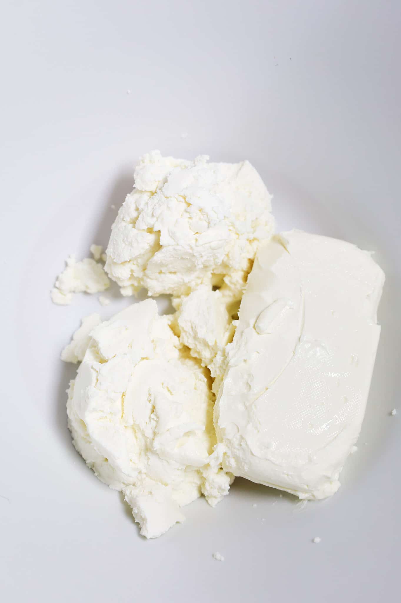 ricotta cheese and cream cheese in a mixing bowl