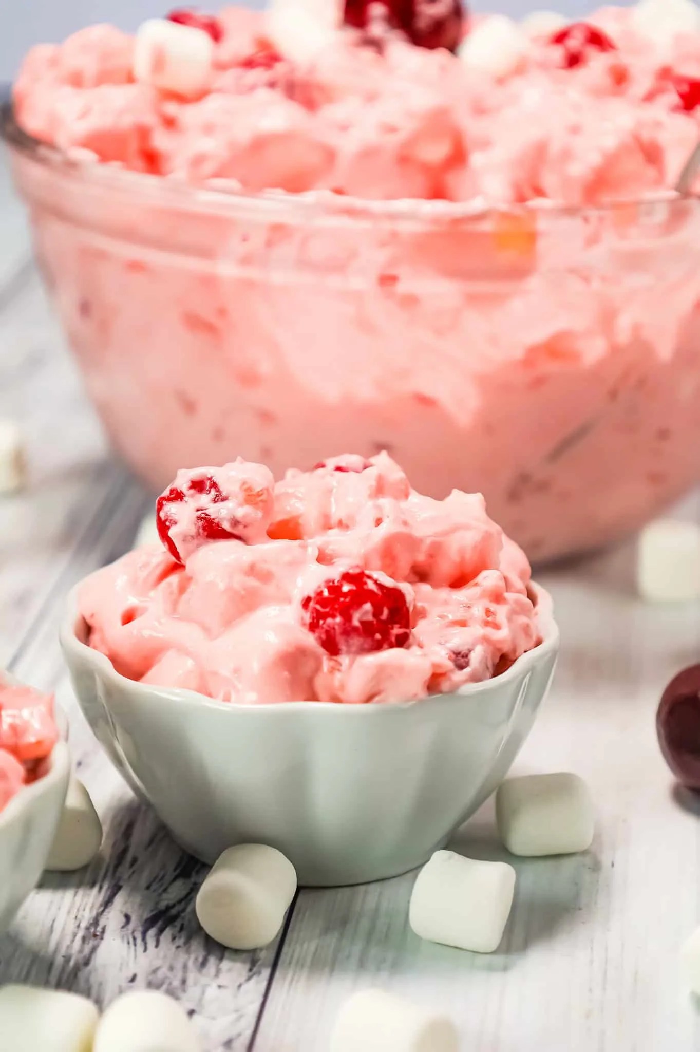 Cherry Fluff is an easy no bake dessert or side dish recipe made with cherry pie filling, crushed pineapple, instant vanilla pudding mix and Cool Whip and loaded with mini marshmallows.