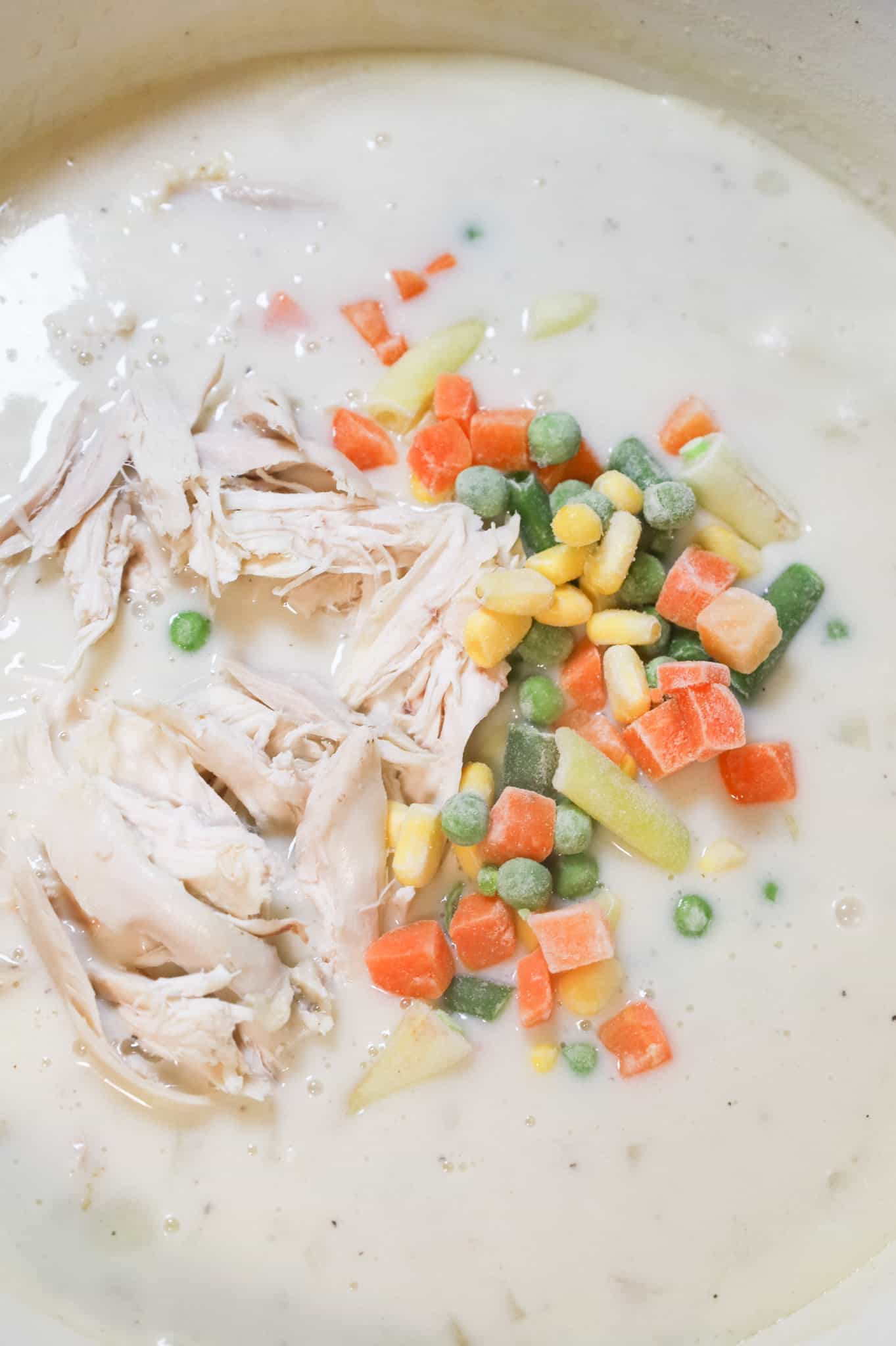 frozen mixed vegetables and shredded chicken added to cream soup