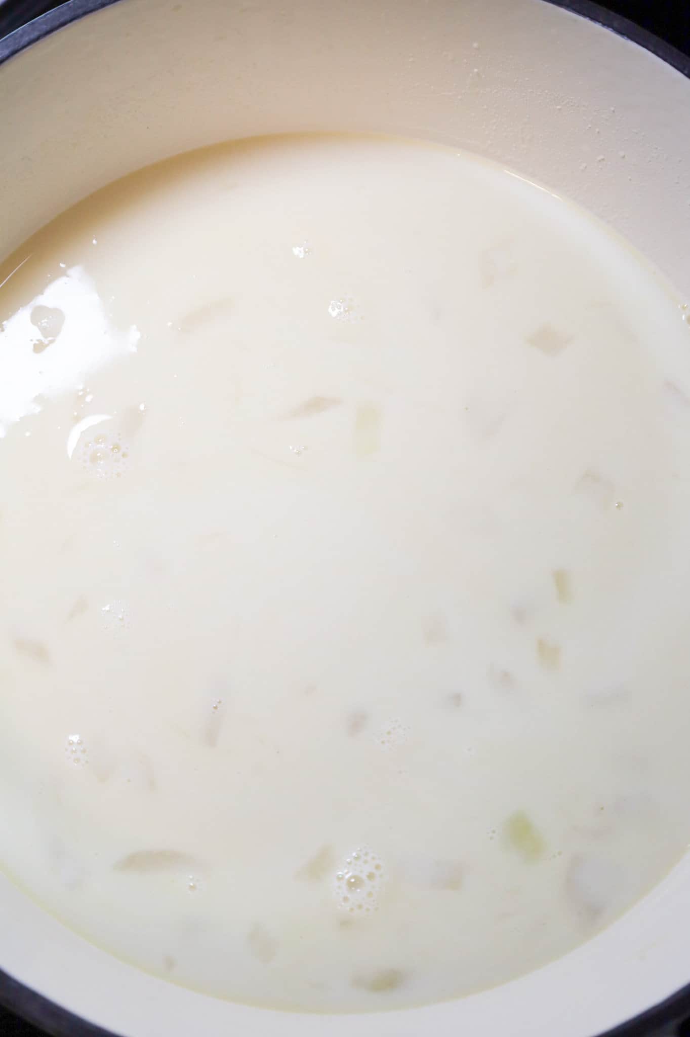 milk and broth mixture in a pot