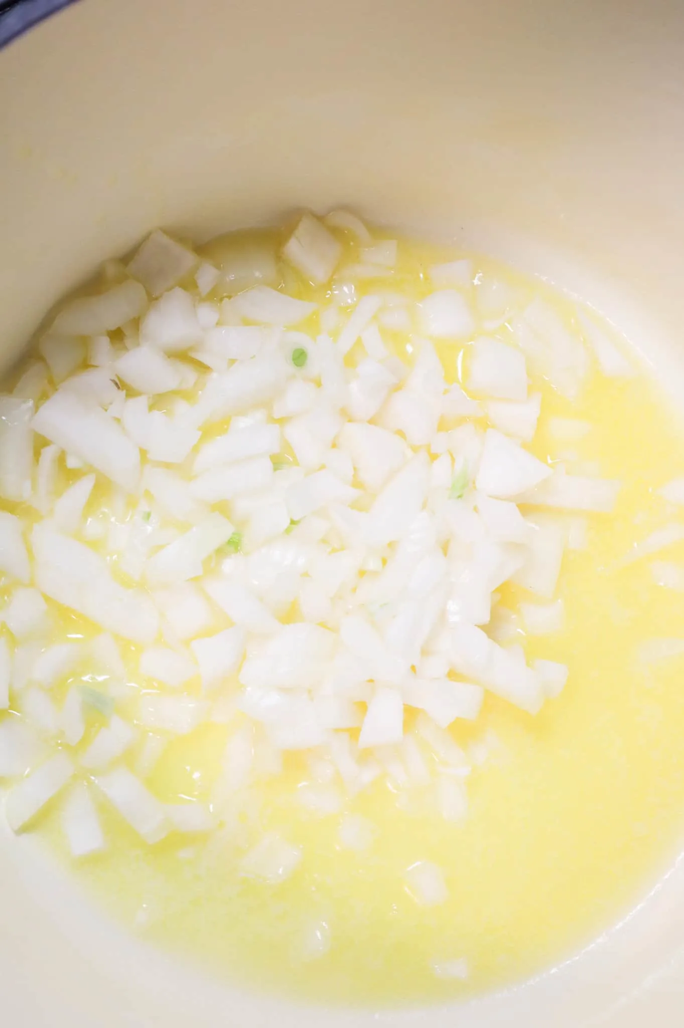 melted butter and diced onions in a pot