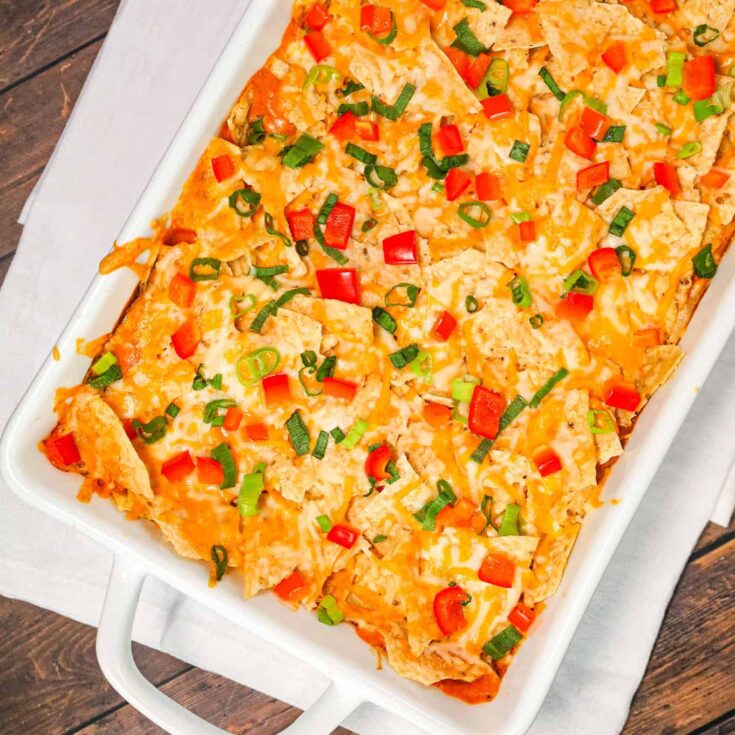 Chicken Taco Casserole is an easy weeknight dinner recipe using rotisserie chicken tossed with, cream cheese, cream of chicken soup, cheddar soup and salsa all topped with crumbled tortilla chips and cheese.
