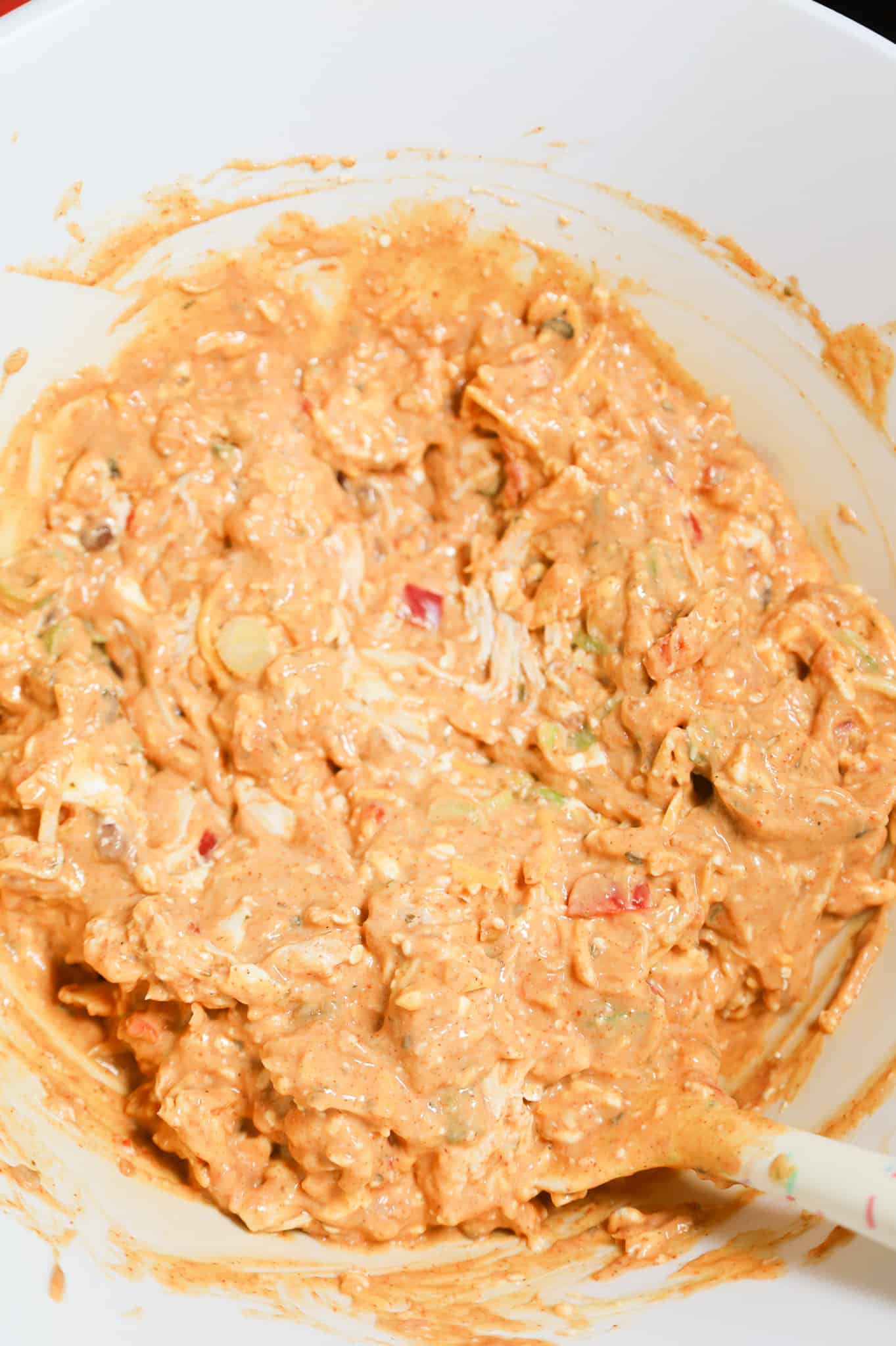 shredded chicken, soup, cream cheese and salsa mixture in a mixing bowl
