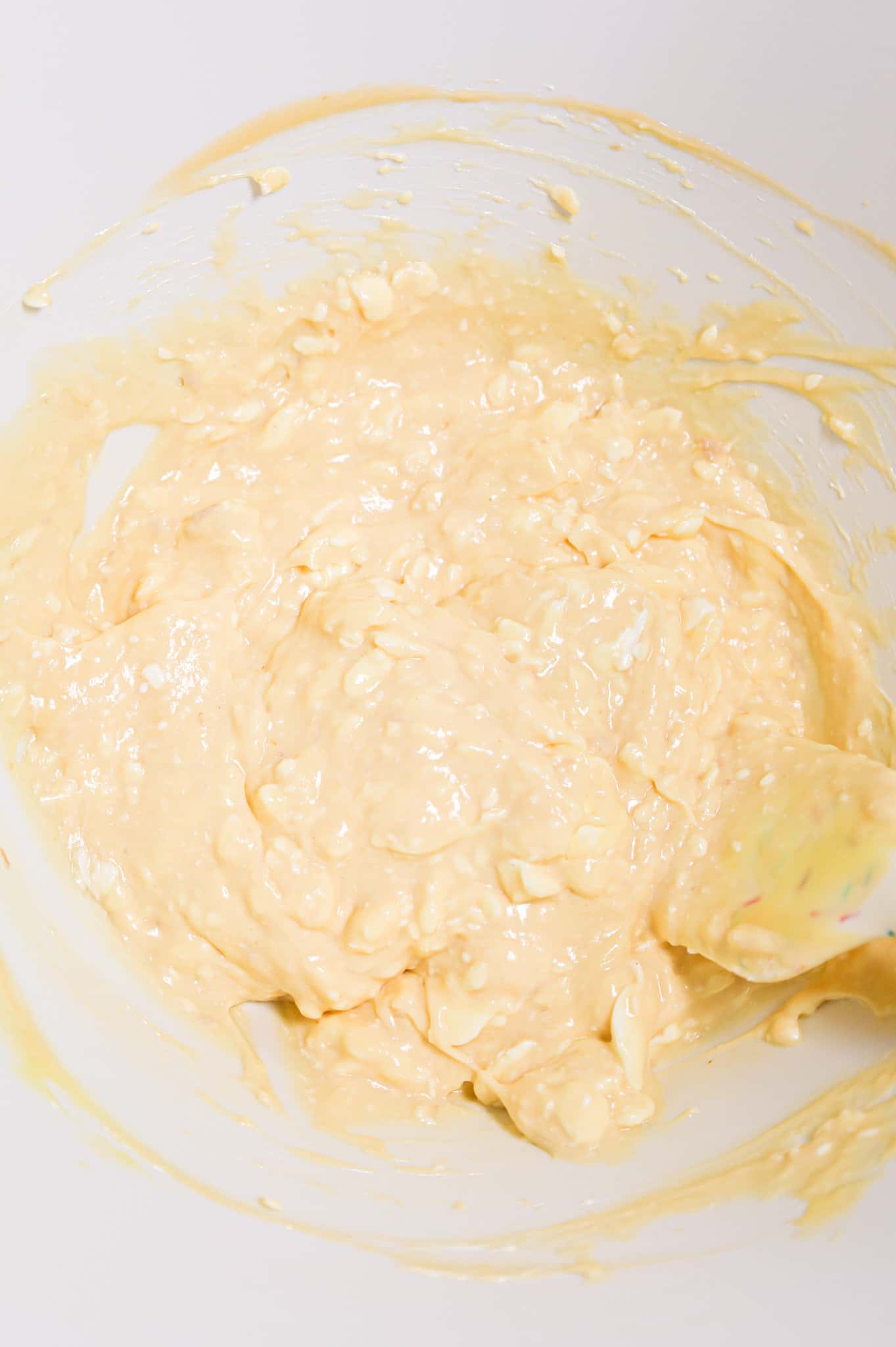 cream cheese, cheddar soup and cream of chicken soup mixture in a mixing bowl