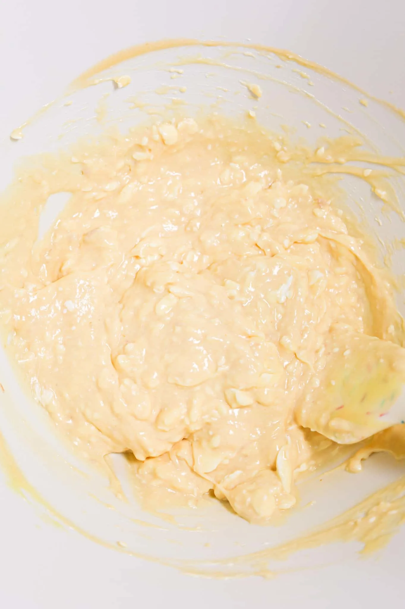 cream cheese, cheddar soup and cream of chicken soup mixture in a mixing bowl