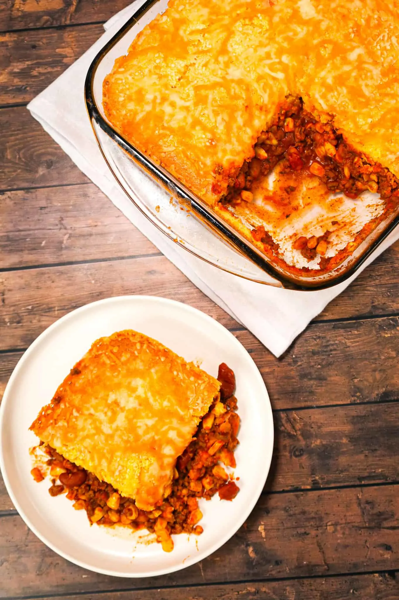 Chili Cornbread Casserole is an easy ground beef dinner recipe loaded with salsa, mixed beans, corn, chili seasoning and topped with cornbread and shredded cheese.