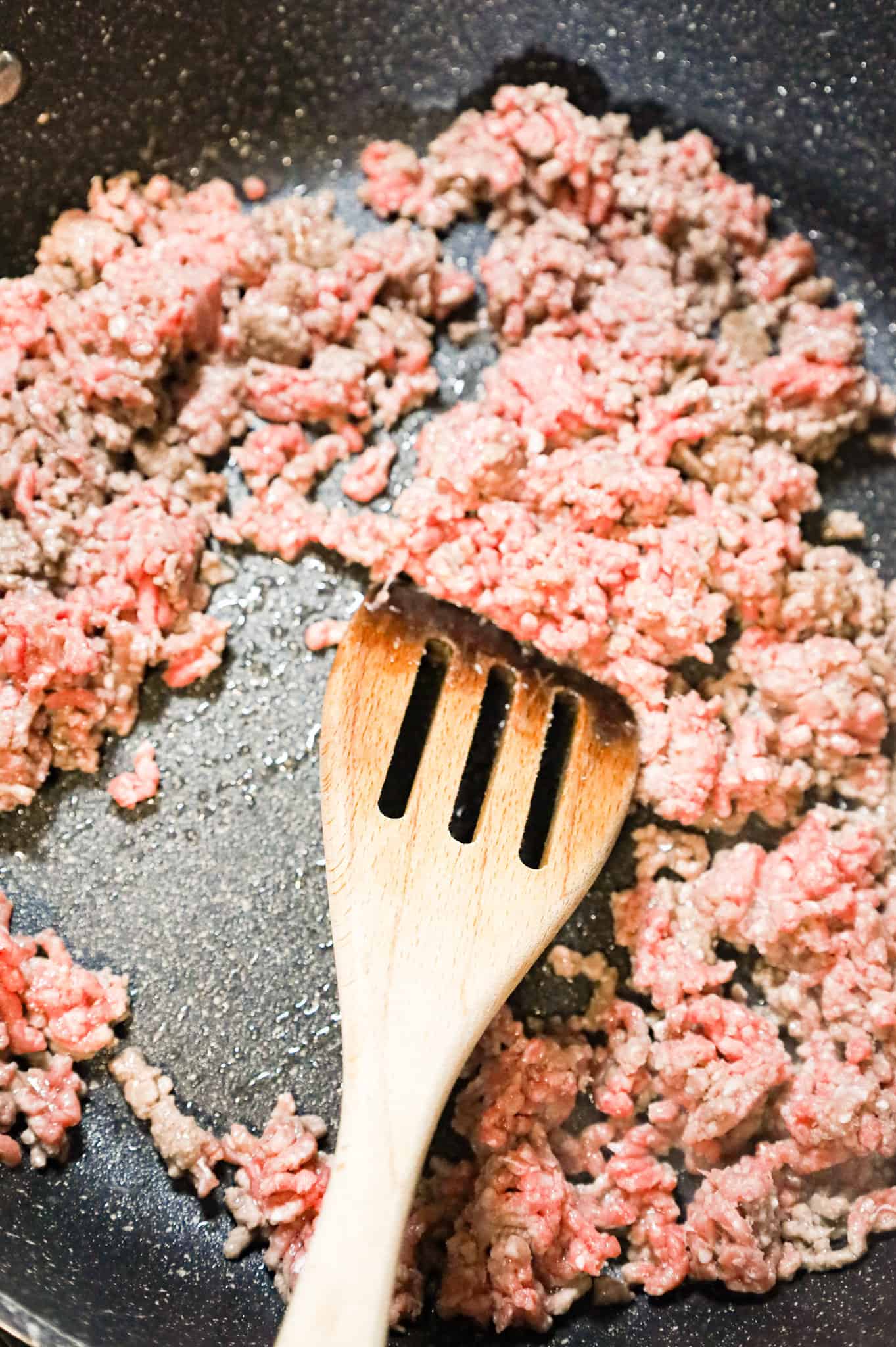 ground beef cooking in a skillet