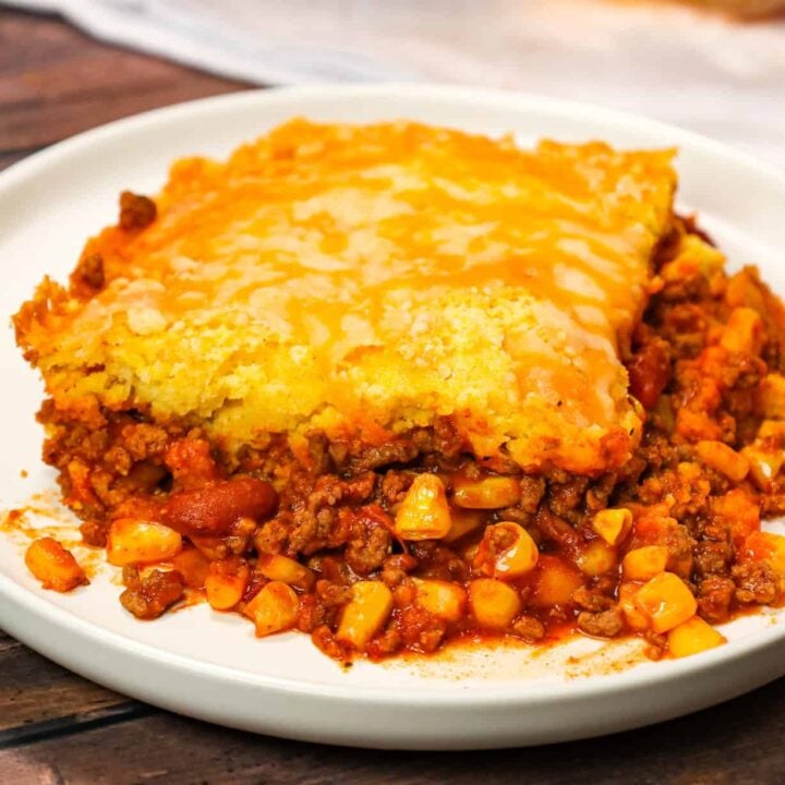 Chili Cornbread Casserole is an easy ground beef dinner recipe loaded with salsa, mixed beans, corn, chili seasoning and topped with cornbread and shredded cheese.