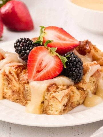 Croissant Bread Pudding is a sweet breakfast treat made with chopped butter croissants baked in an egg custard mixture and topped with a sweet vanilla sauce.