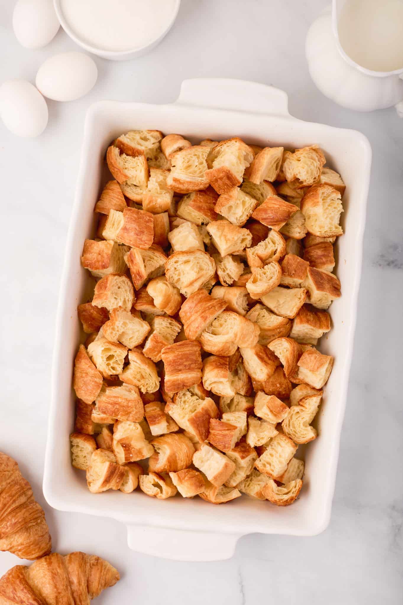 butter croissant chunks in a baking dish