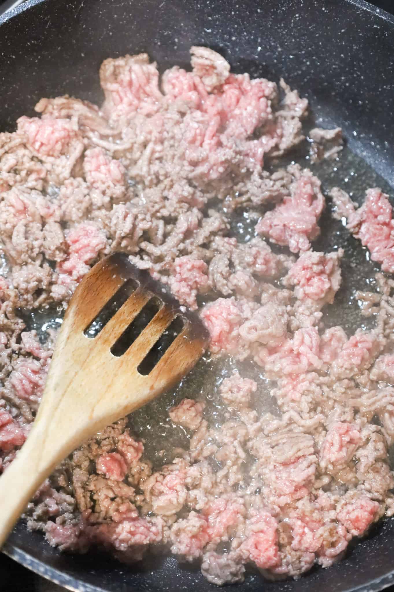 ground beef cooking in a skillet