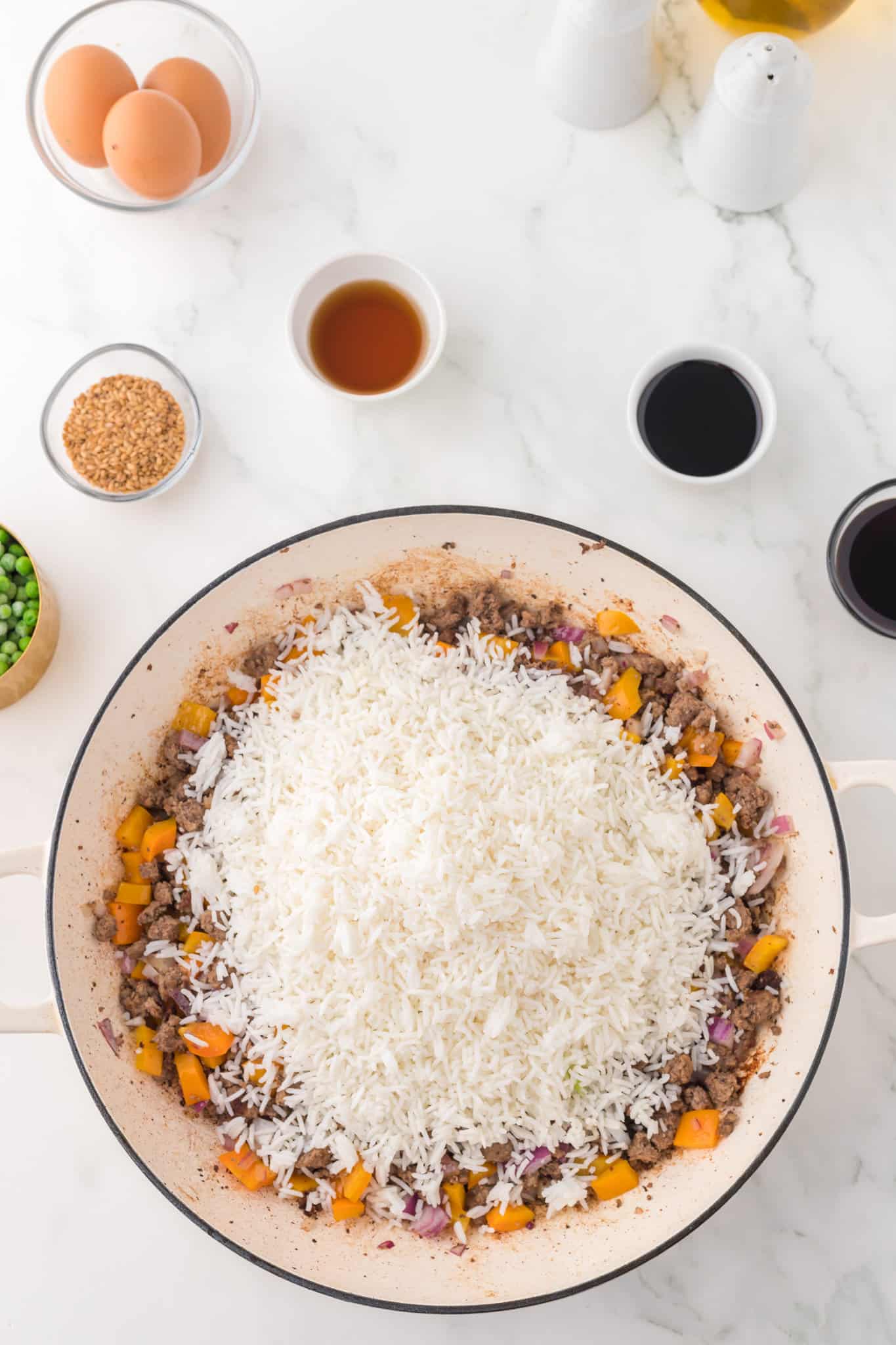 cooked long grain white rice added to skillet with cooked ground beef