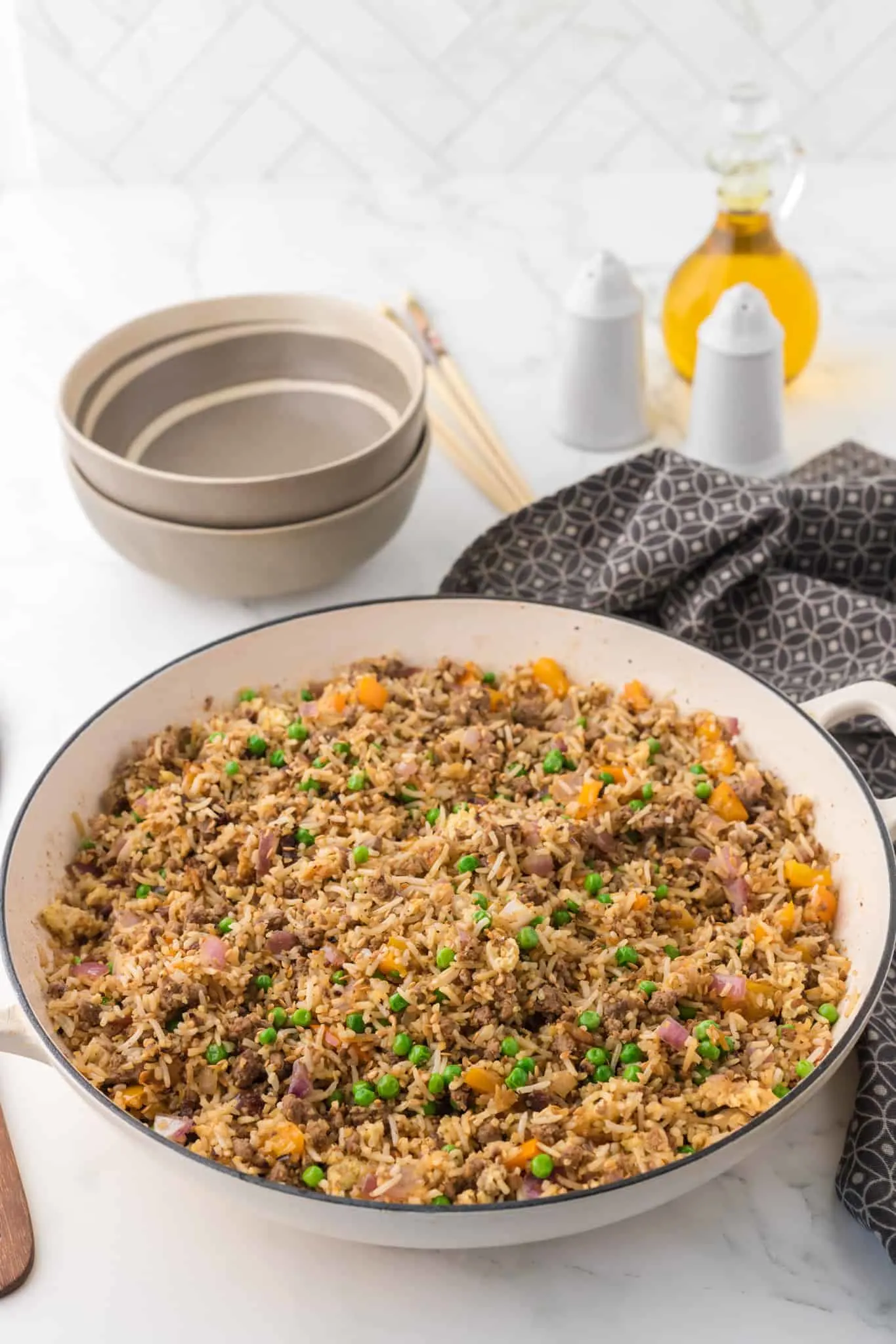 Ground Beef Fried Rice is an easy dinner recipe made with long grain rice and loaded with ground beef, diced bell peppers, peas, sesame seeds and eggs.