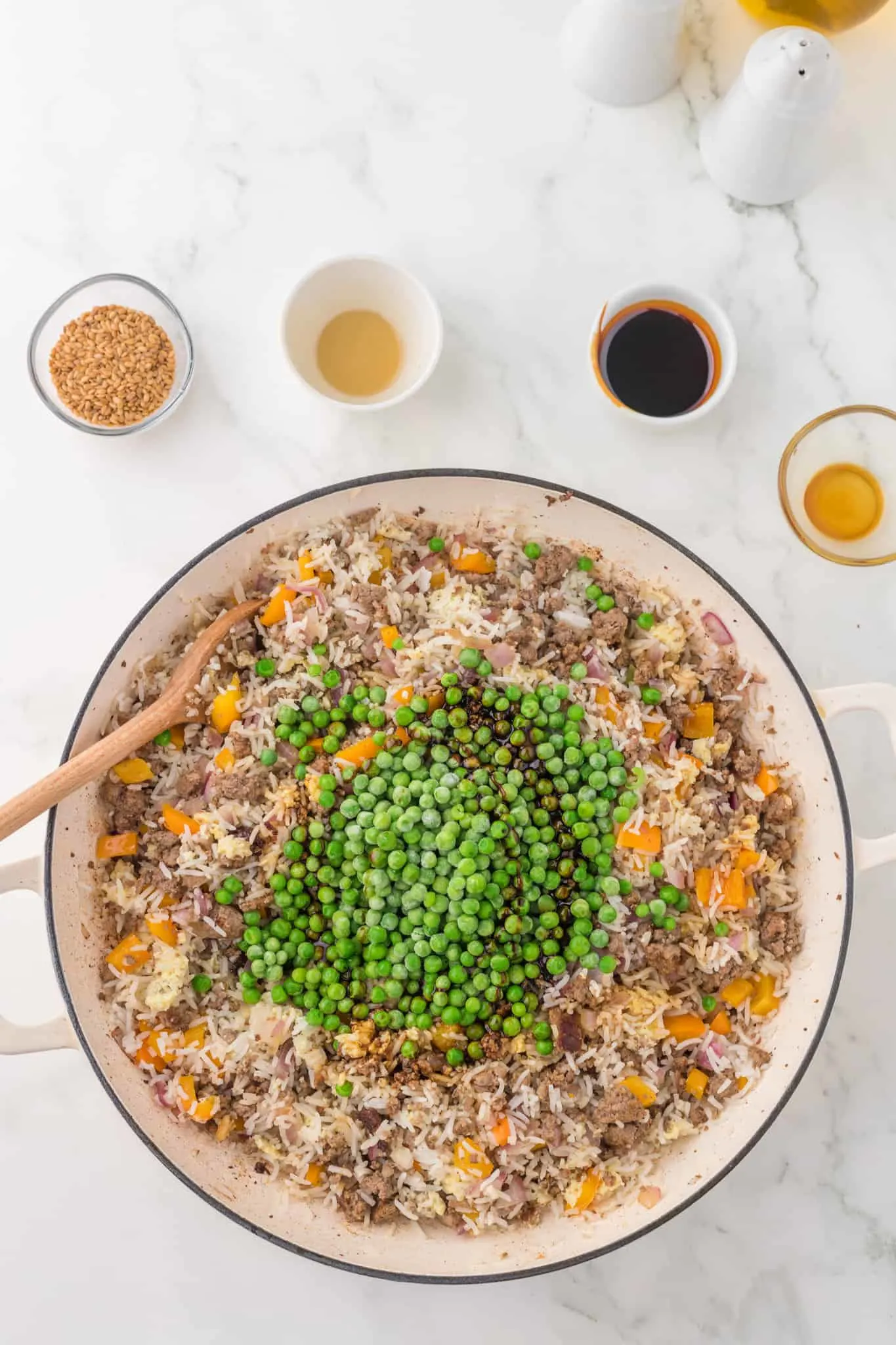 peas added to skillet with ground beef and rice
