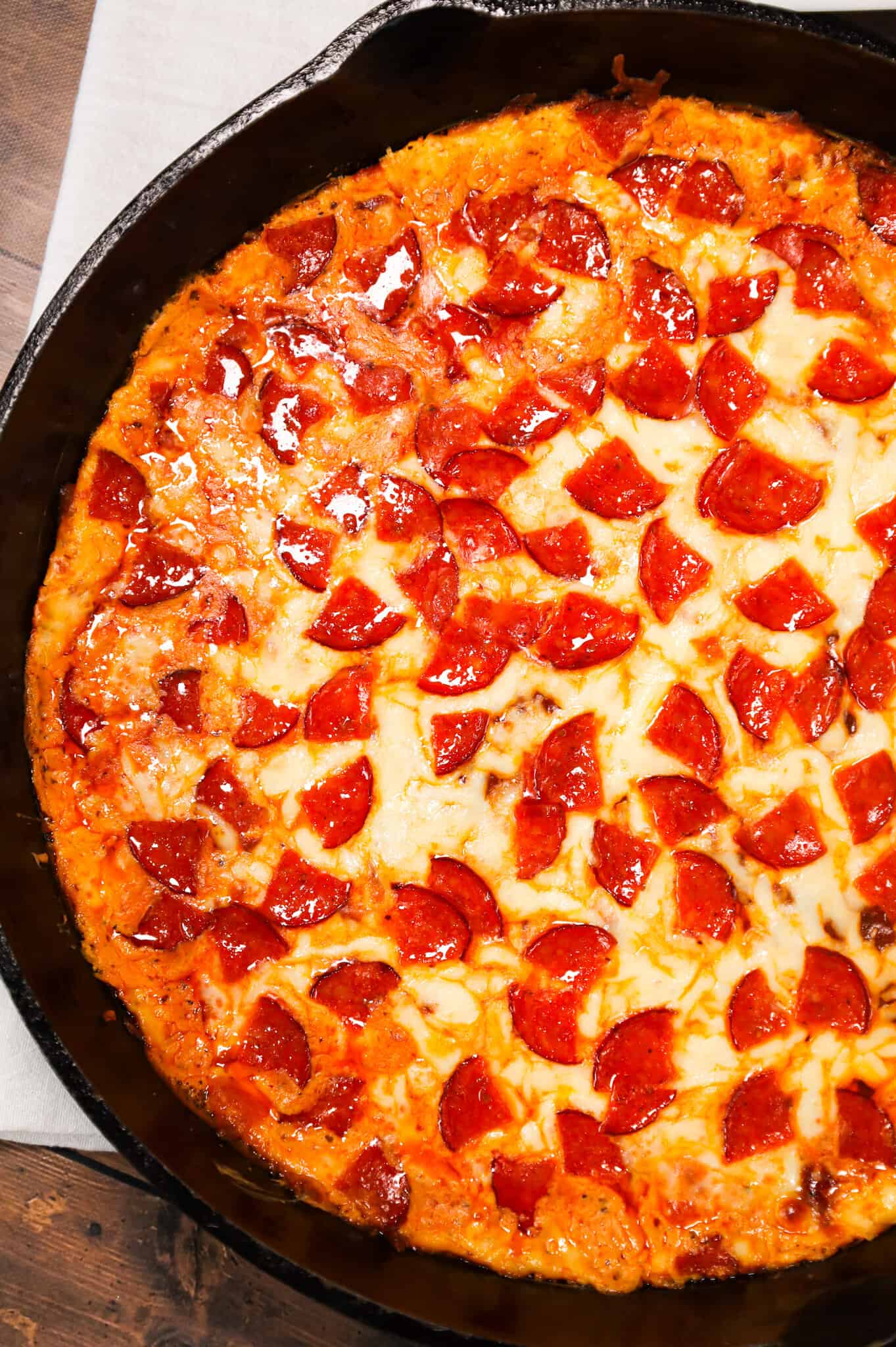 Pepperoni Dip is a delicious hot dip recipe made with cream cheese, ranch dressing, Italian seasoning, pizza sauce, mozzarella cheese, parmesan cheese and chopped pepperoni.