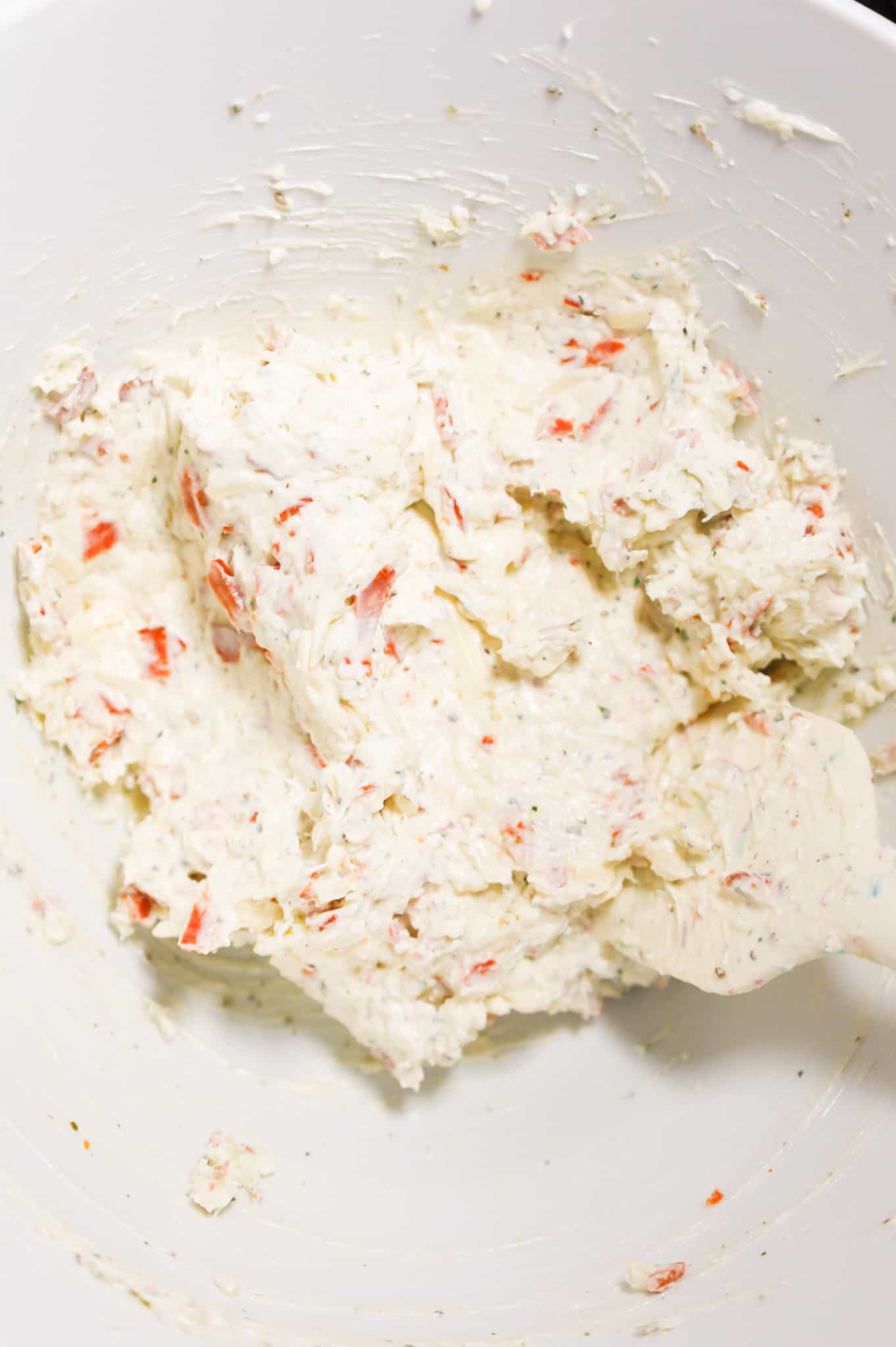 cream cheese, ranch dressing, shredded cheese and pepperoni mixture in a mixing bowl