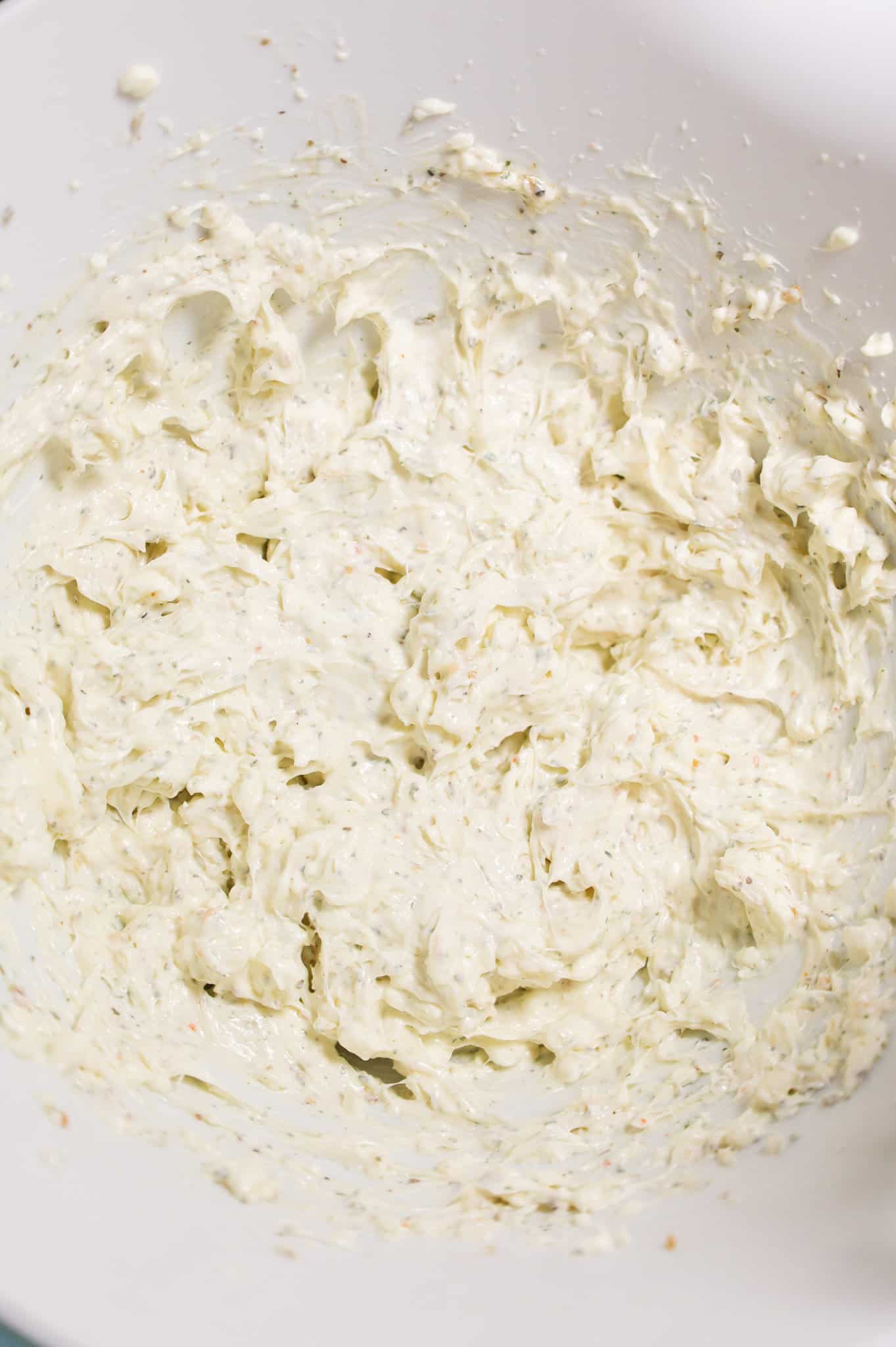 cream cheese, ranch dressing and Italian seasoning mixture in a mixing bowl