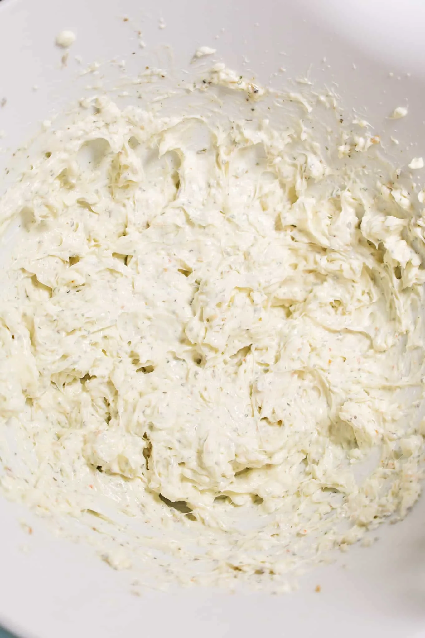 cream cheese, ranch dressing and Italian seasoning mixture in a mixing bowl