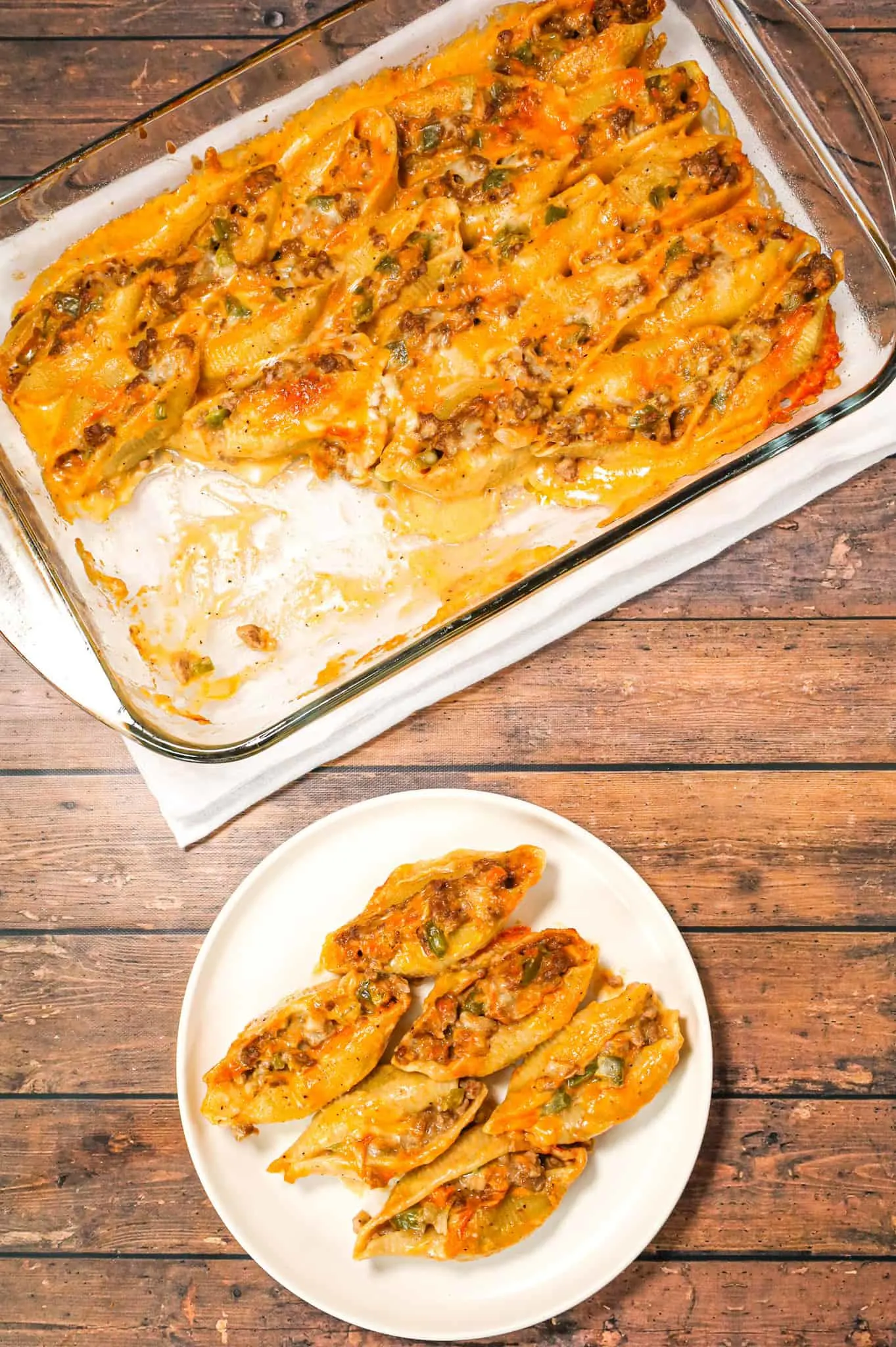 Philly Cheese Steak Stuffed Shells are a hearty pasta recipe loaded with ground beef, diced onions, green peppers, brown gravy mix, cheddar soup and shredded cheddar cheese.