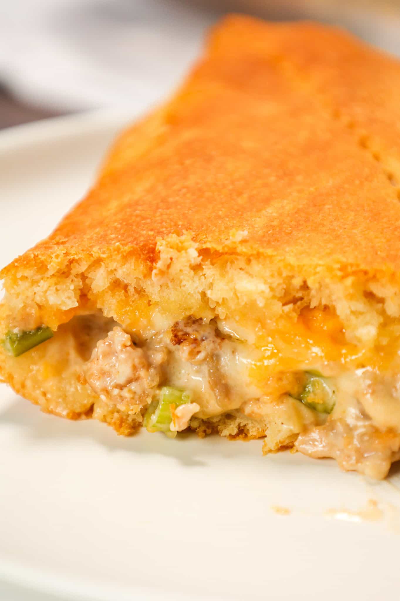 Sausage Cream Cheese Casserole is a delicious breakfast casserole loaded with pork sausage meat, cream cheese, maple syrup, cheddar cheese and green onions all baked between two layers of Pillsbury crescent rolls.