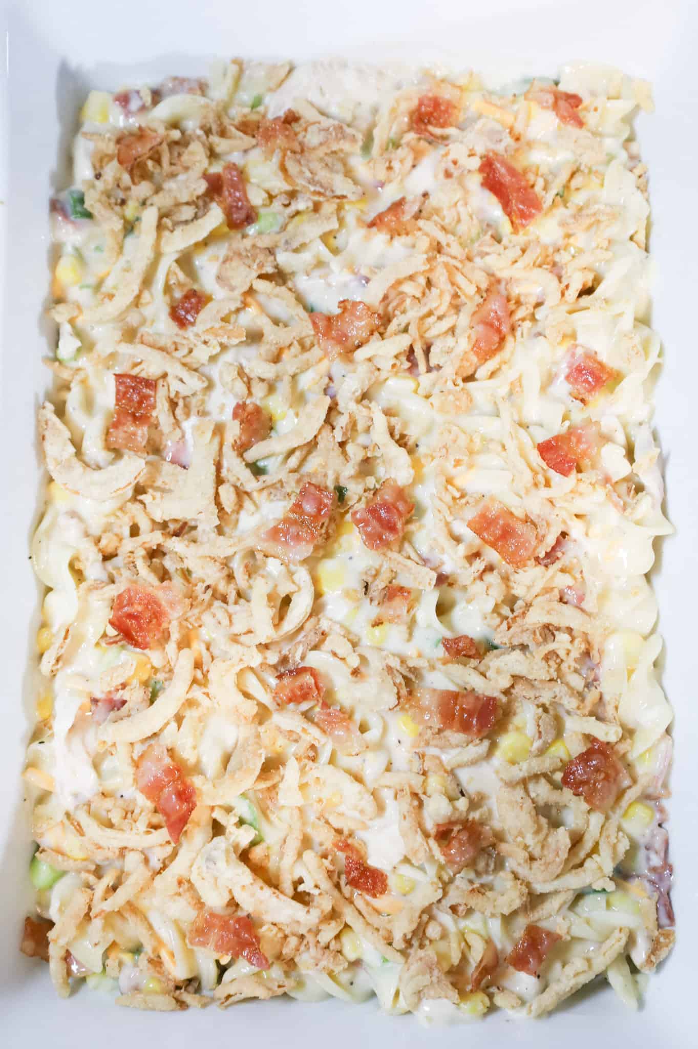 chopped bacon and crispy French's fried onions on top of creamy chicken casserole