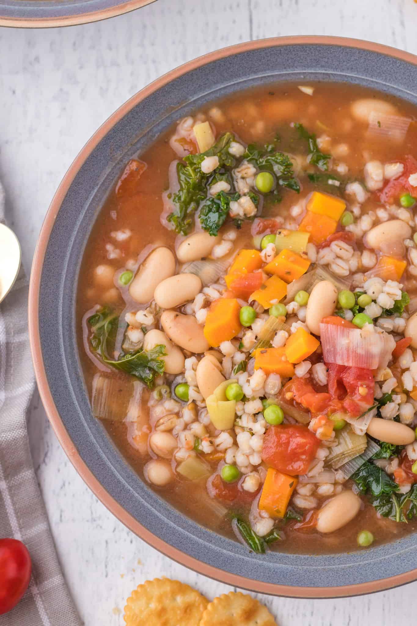 Vegetable Barley Soup is a hearty soup loaded with beans, diced tomatoes, peas, carrots, kale and pearled barley.