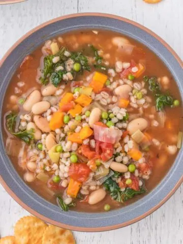 Vegetable Barley Soup is a hearty soup loaded with beans, diced tomatoes, peas, carrots, kale and pearled barley.