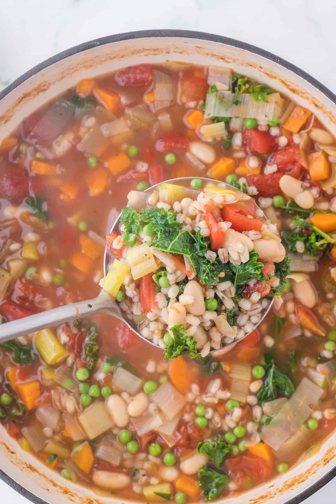 Vegetable Barley Soup is a hearty soup loaded with beans, diced tomatoes, peas, carrots, kale and pearled barley.