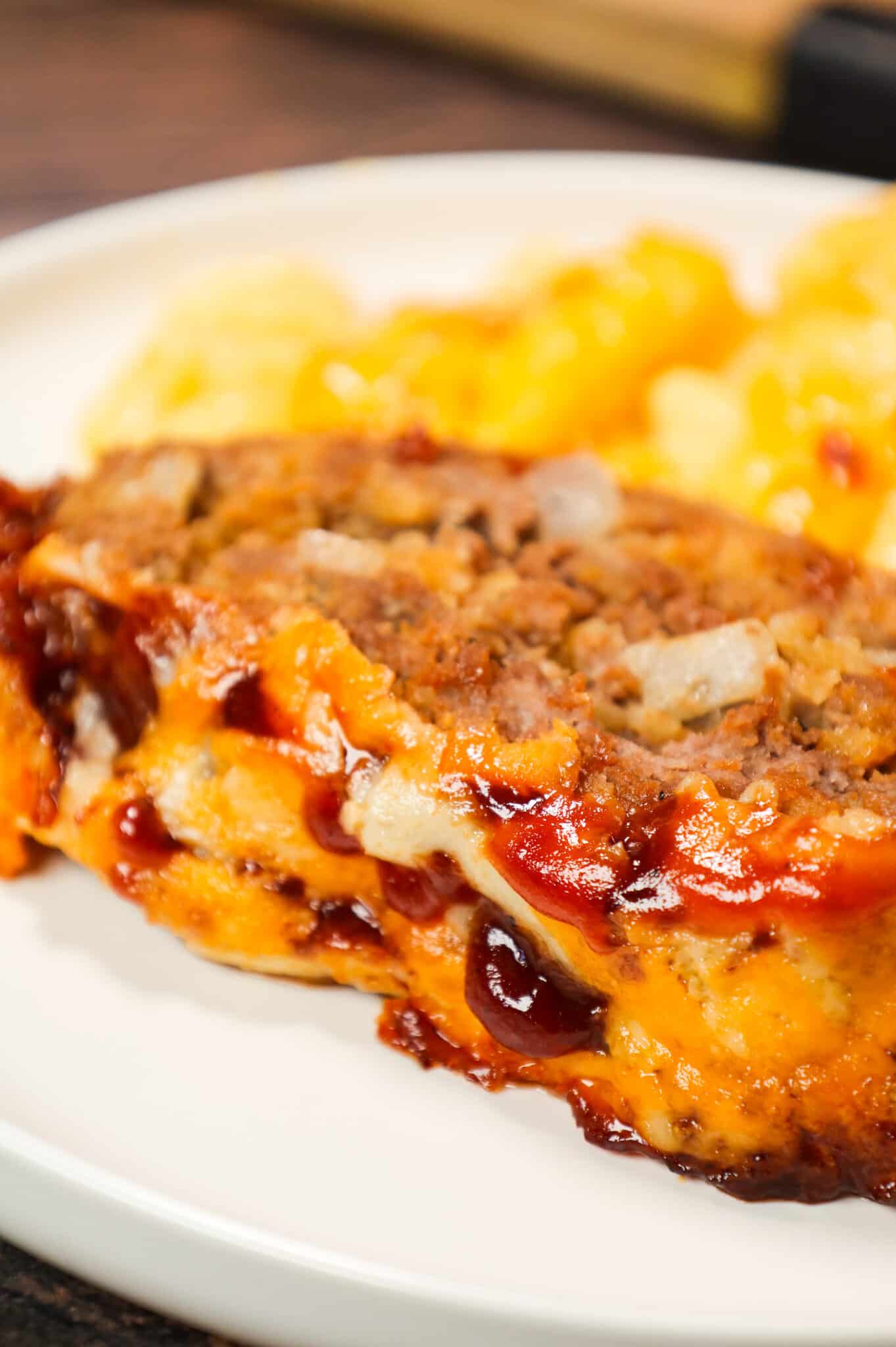 BBQ Meatloaf is a hearty ground beef dinner recipe loaded with crushed BBQ flavoured potato chips, BBQ sauce and shredded cheddar cheese.