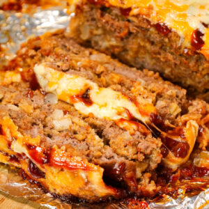 BBQ Meatloaf is a hearty ground beef dinner recipe loaded with crushed BBQ flavoured potato chips, BBQ sauce and shredded cheddar cheese.