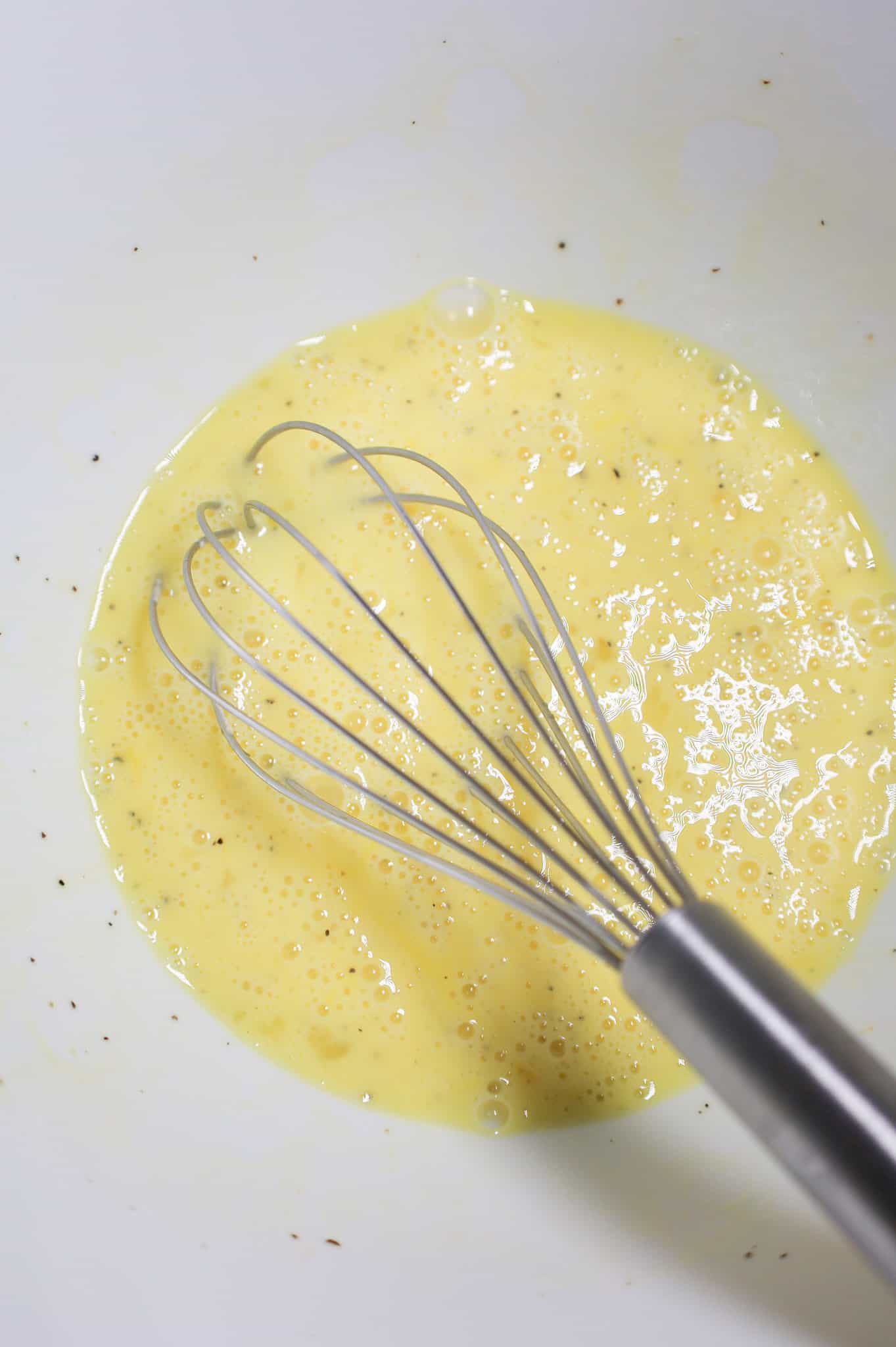whisked egg mixture in a mixing bowl