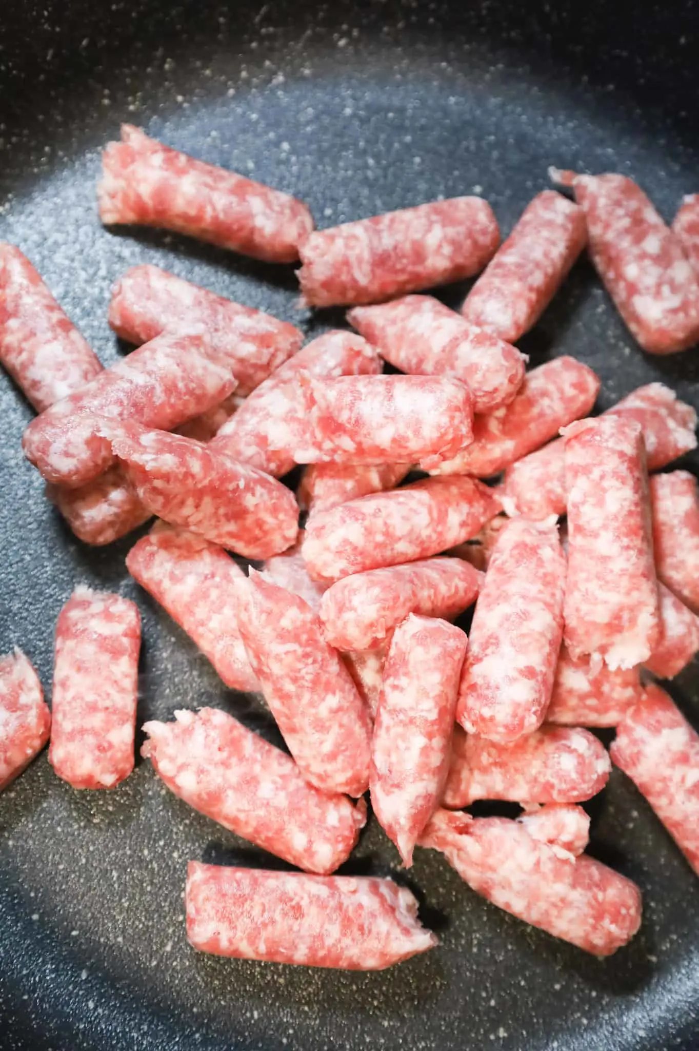 pork sausage meat in a skillet