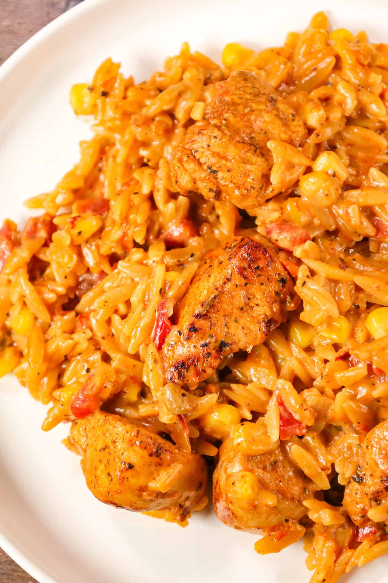 Cajun Chicken Orzo is a delicious one pot dinner recipe loaded with chicken breast chunks, corn, Rotel diced tomatoes and orzo pasta all in a creamy Cajun sauce.