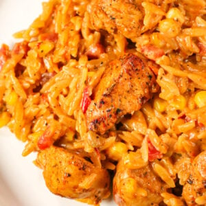 Cajun Chicken Orzo is a delicious one pot dinner recipe loaded with chicken breast chunks, corn, Rotel diced tomatoes and orzo pasta all in a creamy Cajun sauce.