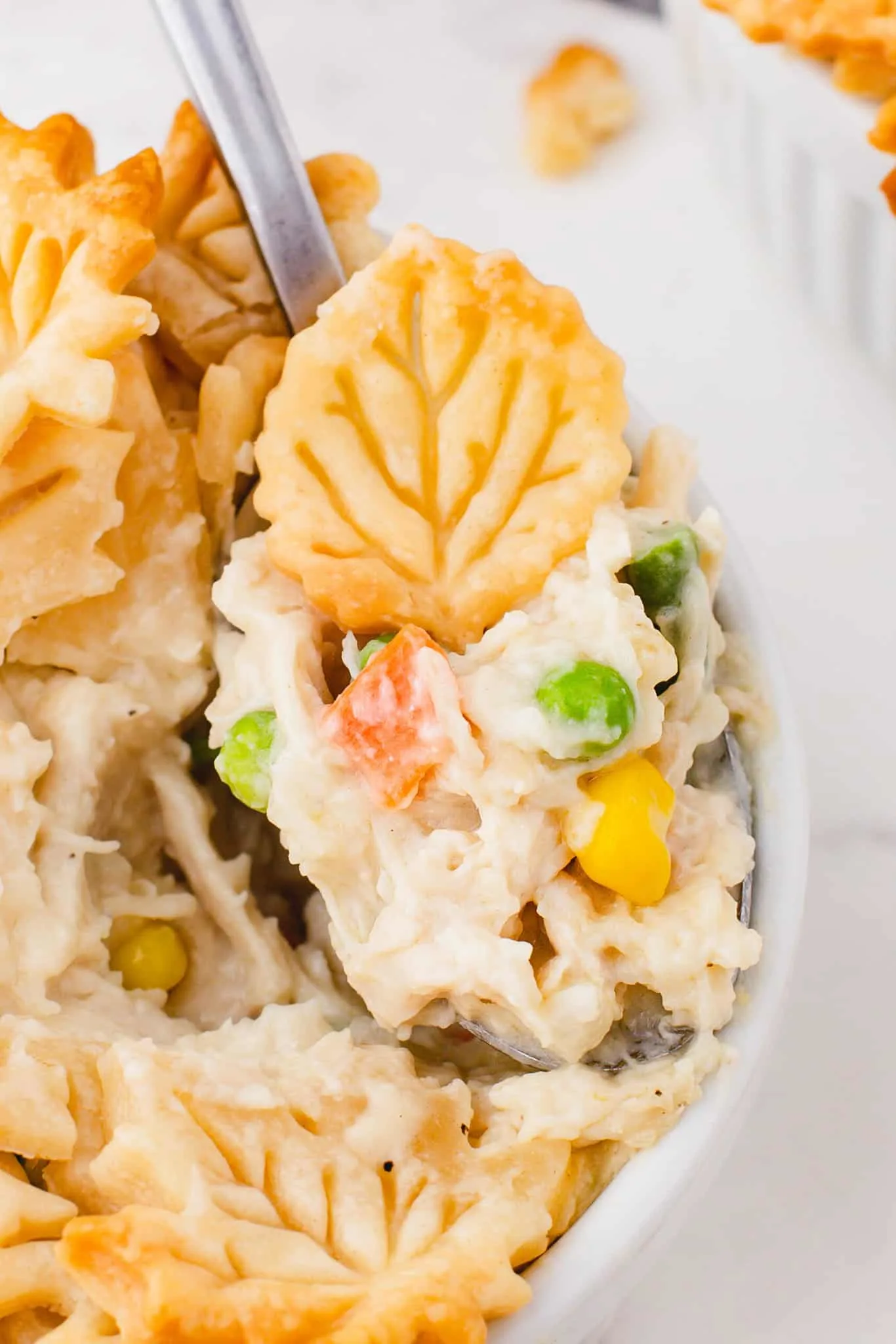 Easy Chicken Pot Pie is a hearty comfort food dish with a creamy chicken and vegetable filling topped with golden brown Pillsbury pie crust.