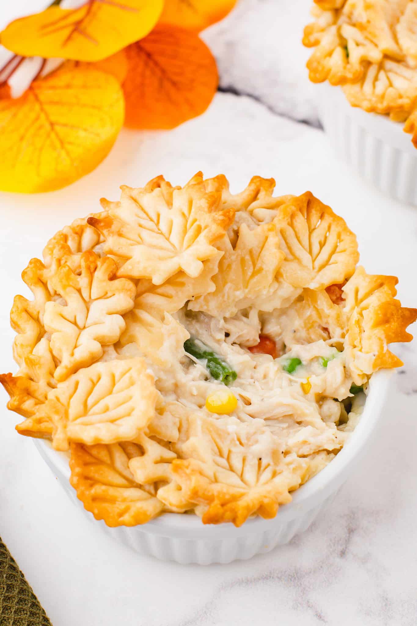 Easy Chicken Pot Pie is a hearty comfort food dish with a creamy chicken and vegetable filling topped with golden brown Pillsbury pie crust.