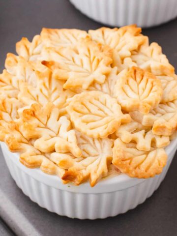 Easy Chicken Pot Pie is a hearty comfort food dish with a creamy chicken and vegetable filling topped with golden brown Pillsbury pie crust.