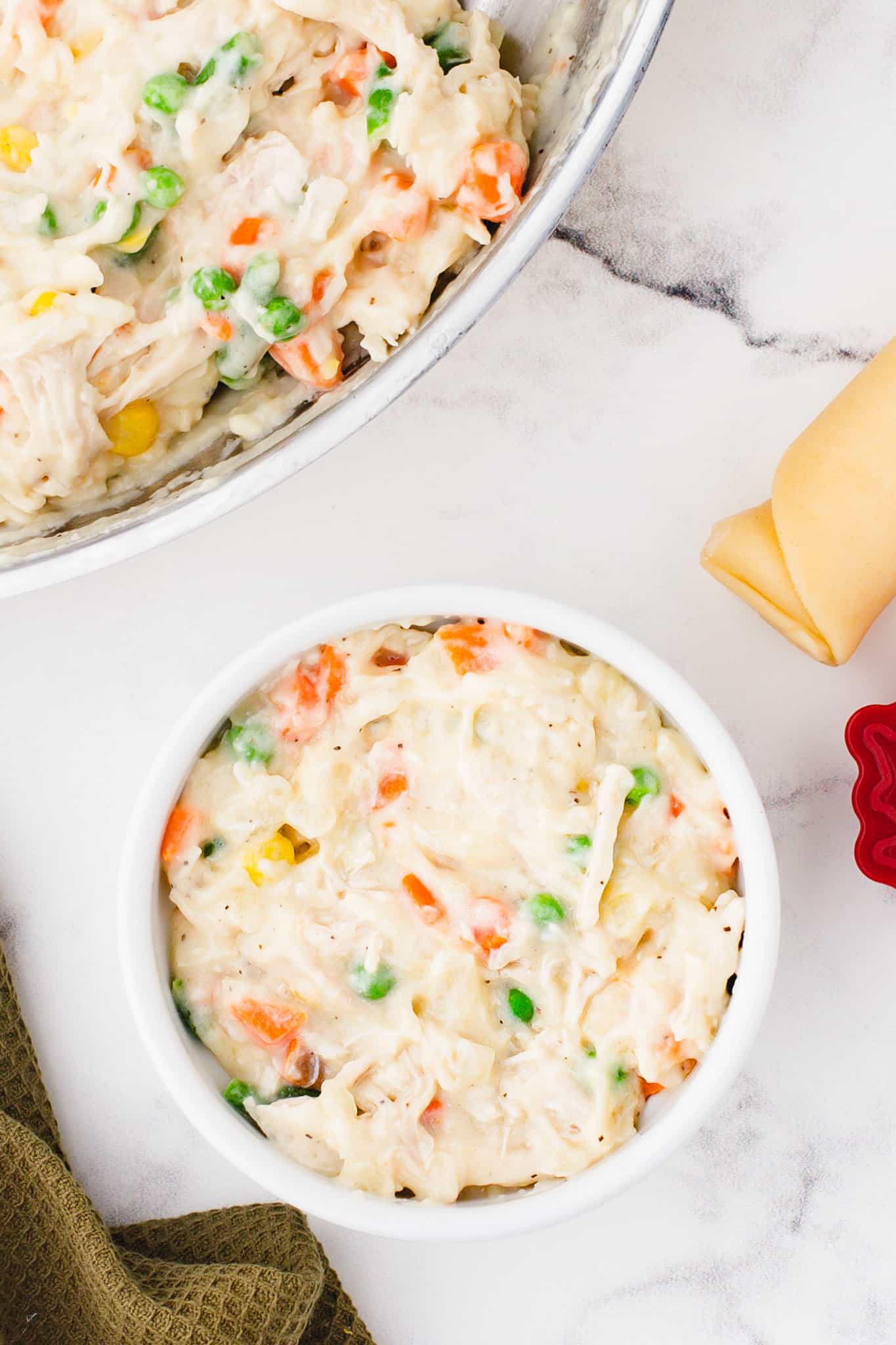 creamy chicken and vegetable mixture in a ramekin