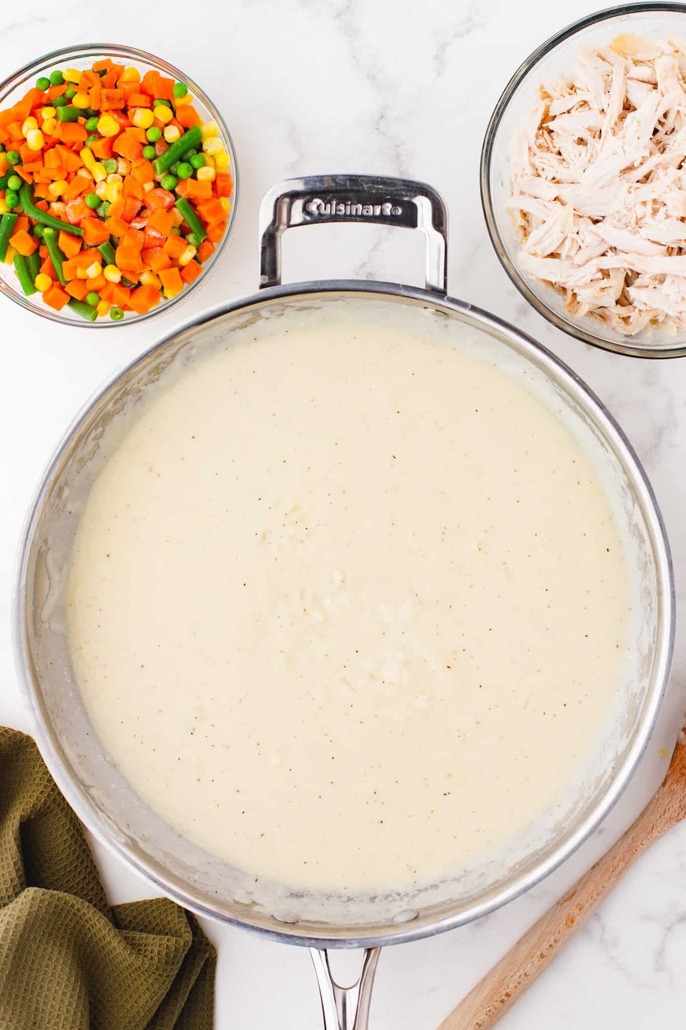 creamy chicken broth mixture in a skillet