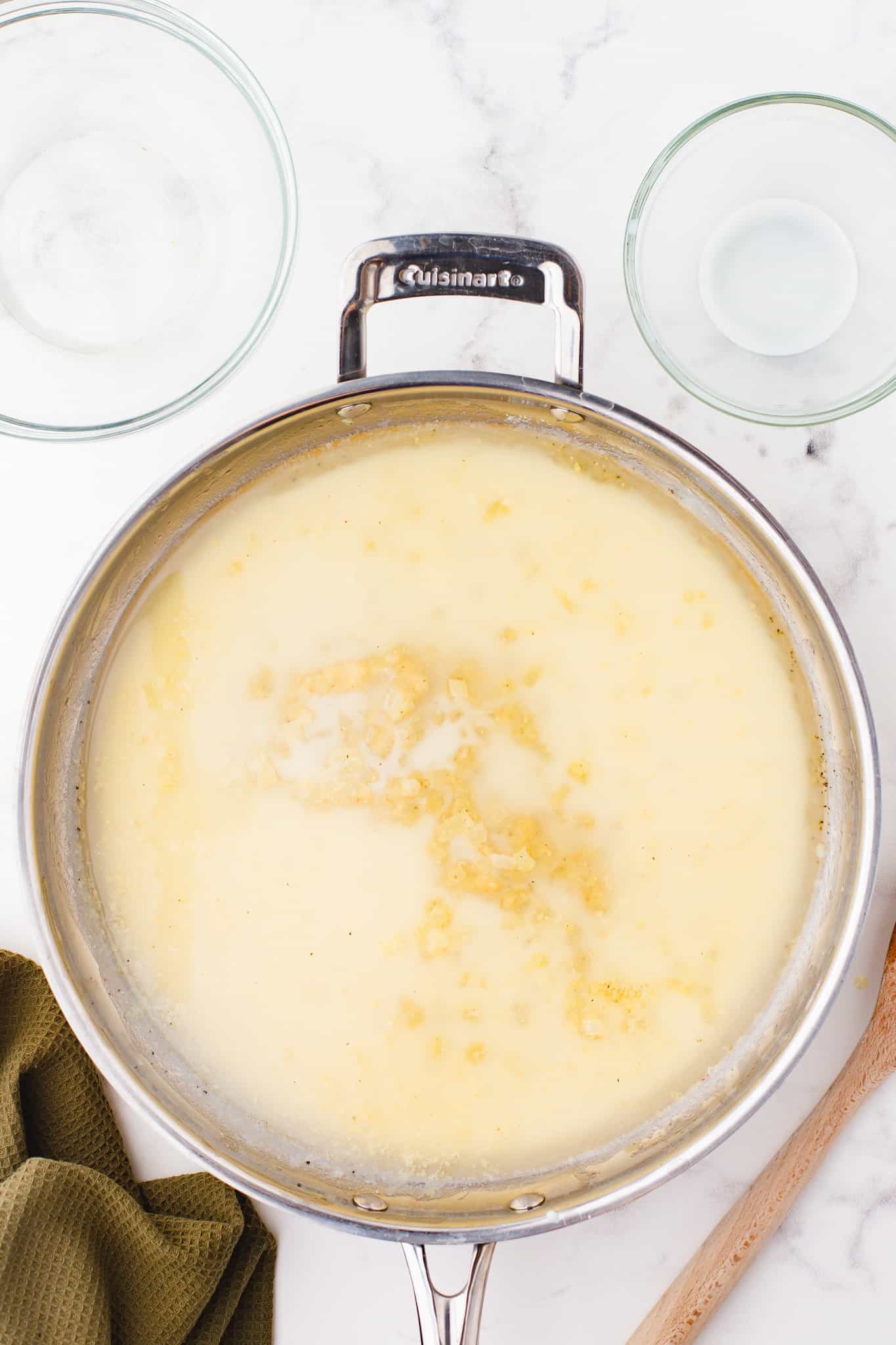 chicken broth and half and half added to skillet with flour, butter and onion mixture