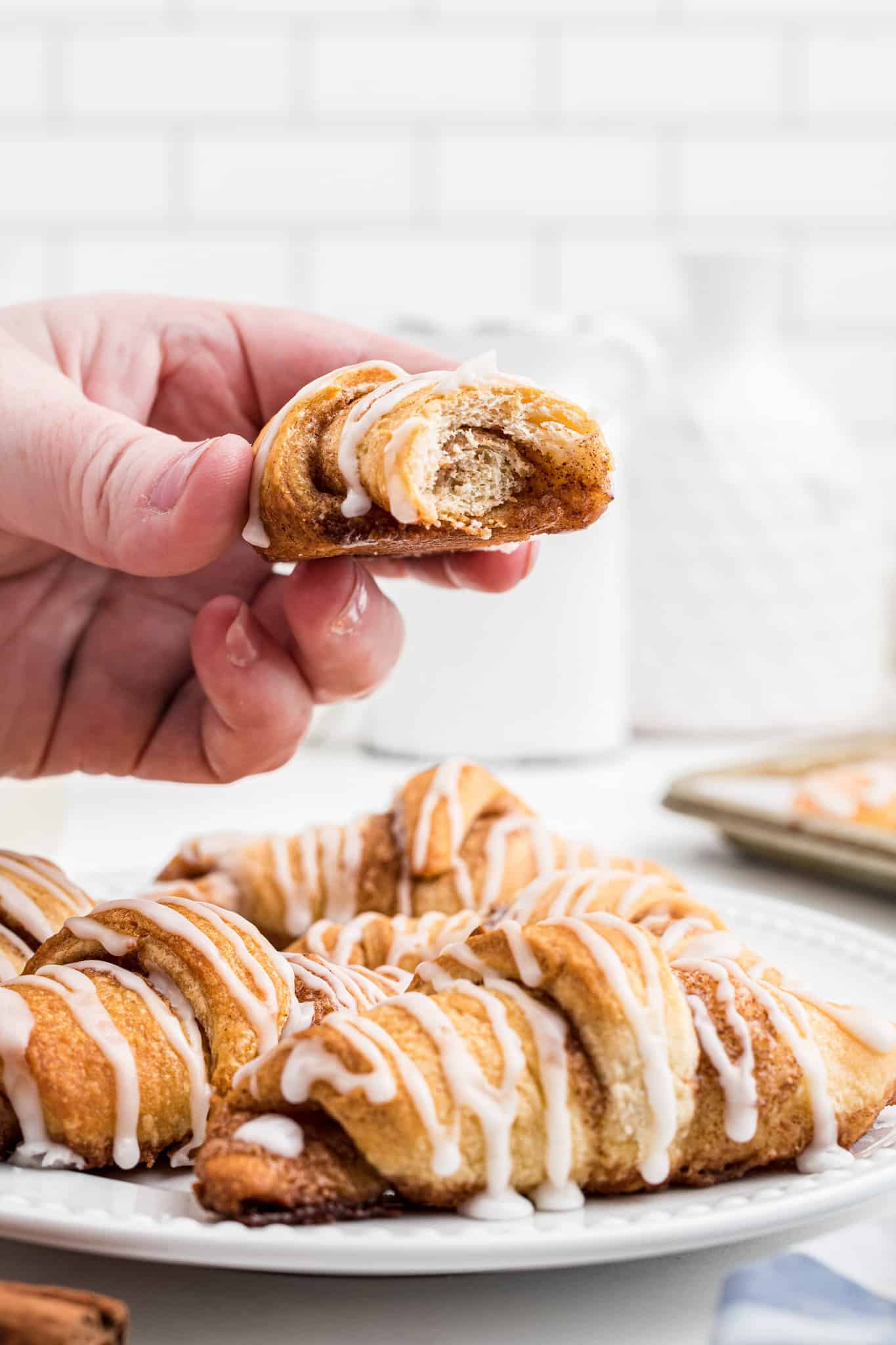 Cinnamon Crescent Rolls are an easy breakfast or dessert recipe using Pillsbury crescent rolls filled with a sweet cinnamon mixture and drizzled with icing.