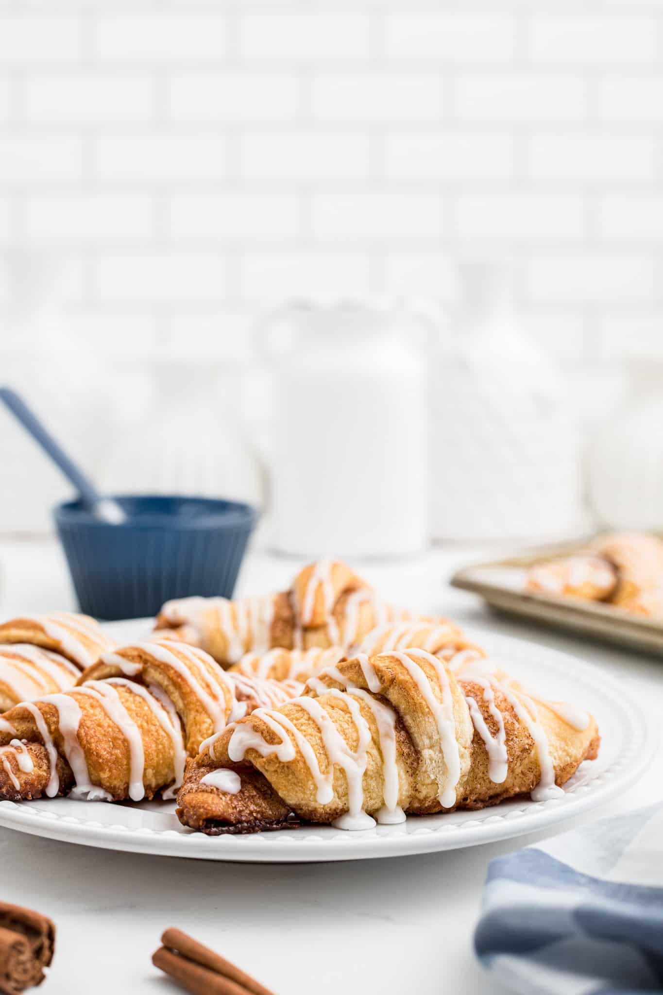 Cinnamon Crescent Rolls are an easy breakfast or dessert recipe using Pillsbury crescent rolls filled with a sweet cinnamon mixture and drizzled with icing.