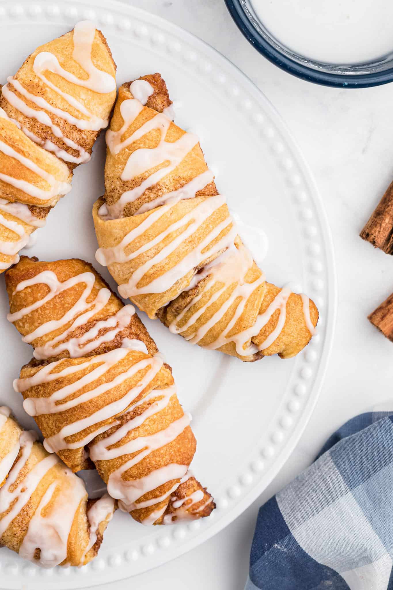 Cinnamon Crescent Rolls are an easy breakfast or dessert recipe using Pillsbury crescent rolls filled with a sweet cinnamon mixture and drizzled with icing.