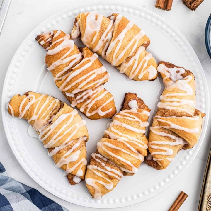 Cinnamon Crescent Rolls are an easy breakfast or dessert recipe using Pillsbury crescent rolls filled with a sweet cinnamon mixture and drizzled with icing.