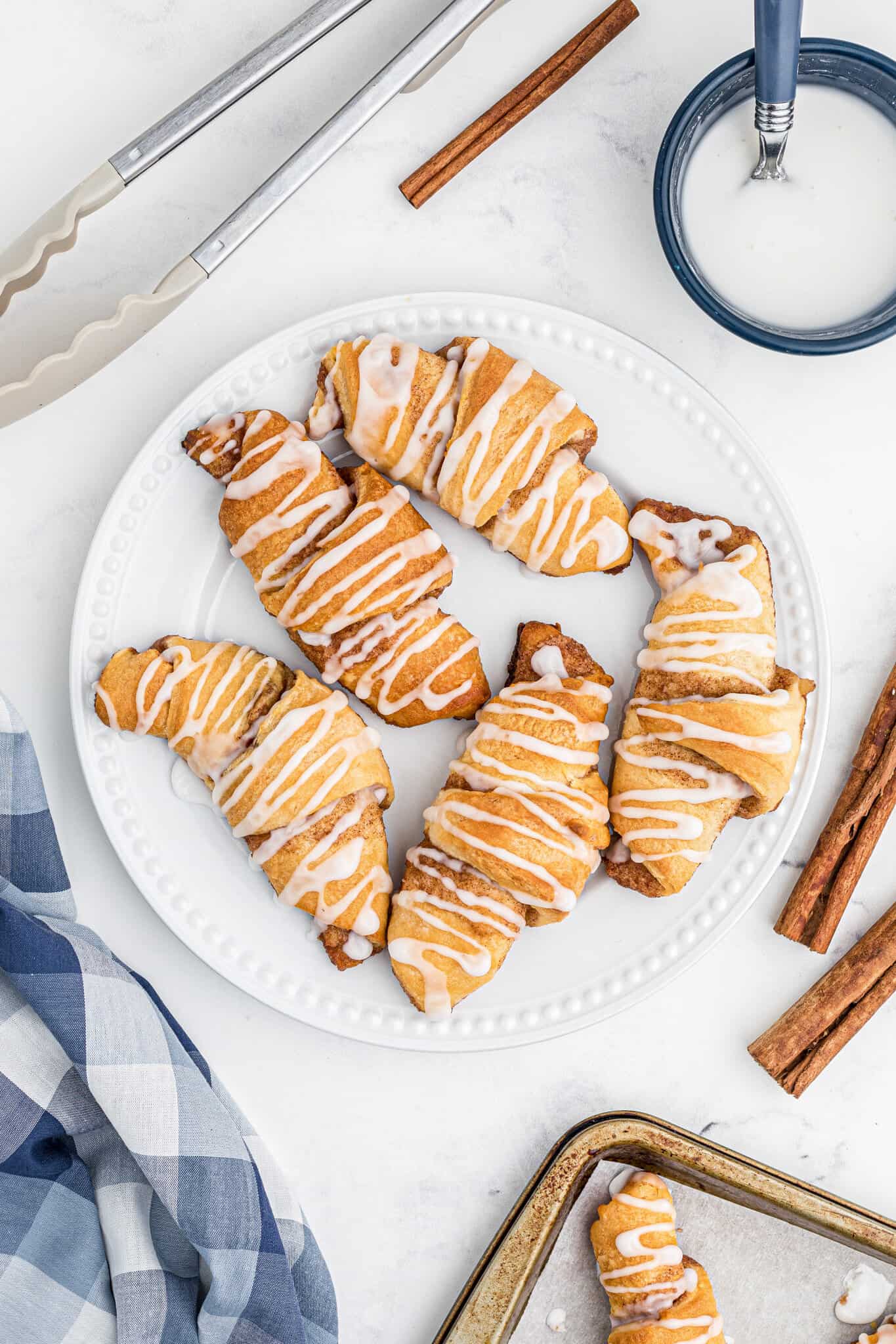 Cinnamon Crescent Rolls are an easy breakfast or dessert recipe using Pillsbury crescent rolls filled with a sweet cinnamon mixture and drizzled with icing.