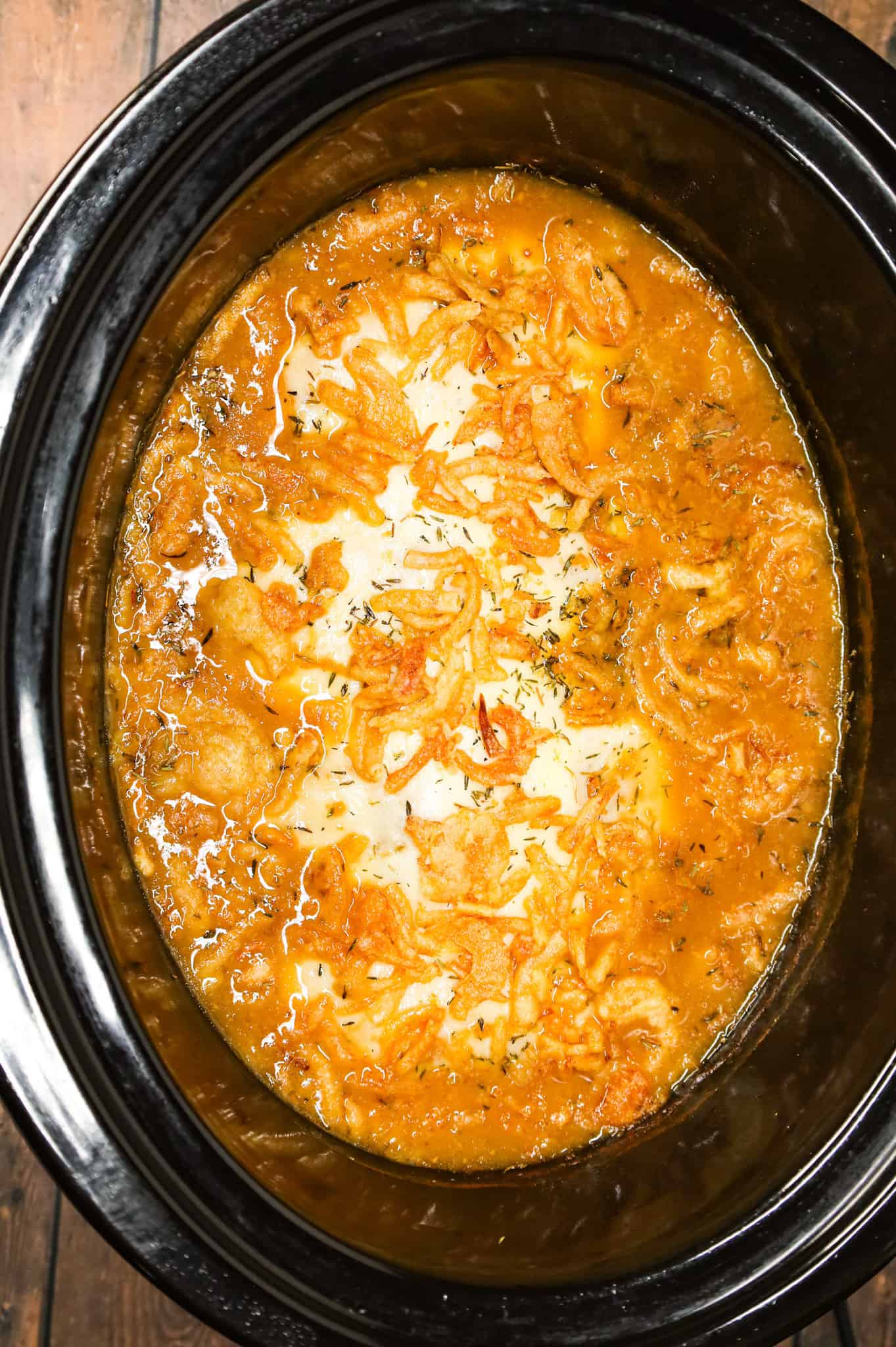 Crock Pot French Onion Chicken is an easy slow cooker chicken breasts recipe made with beef broth, onion soup mix, yellow onions, cream of chicken soup, provolone cheese and French's crispy fried onions.