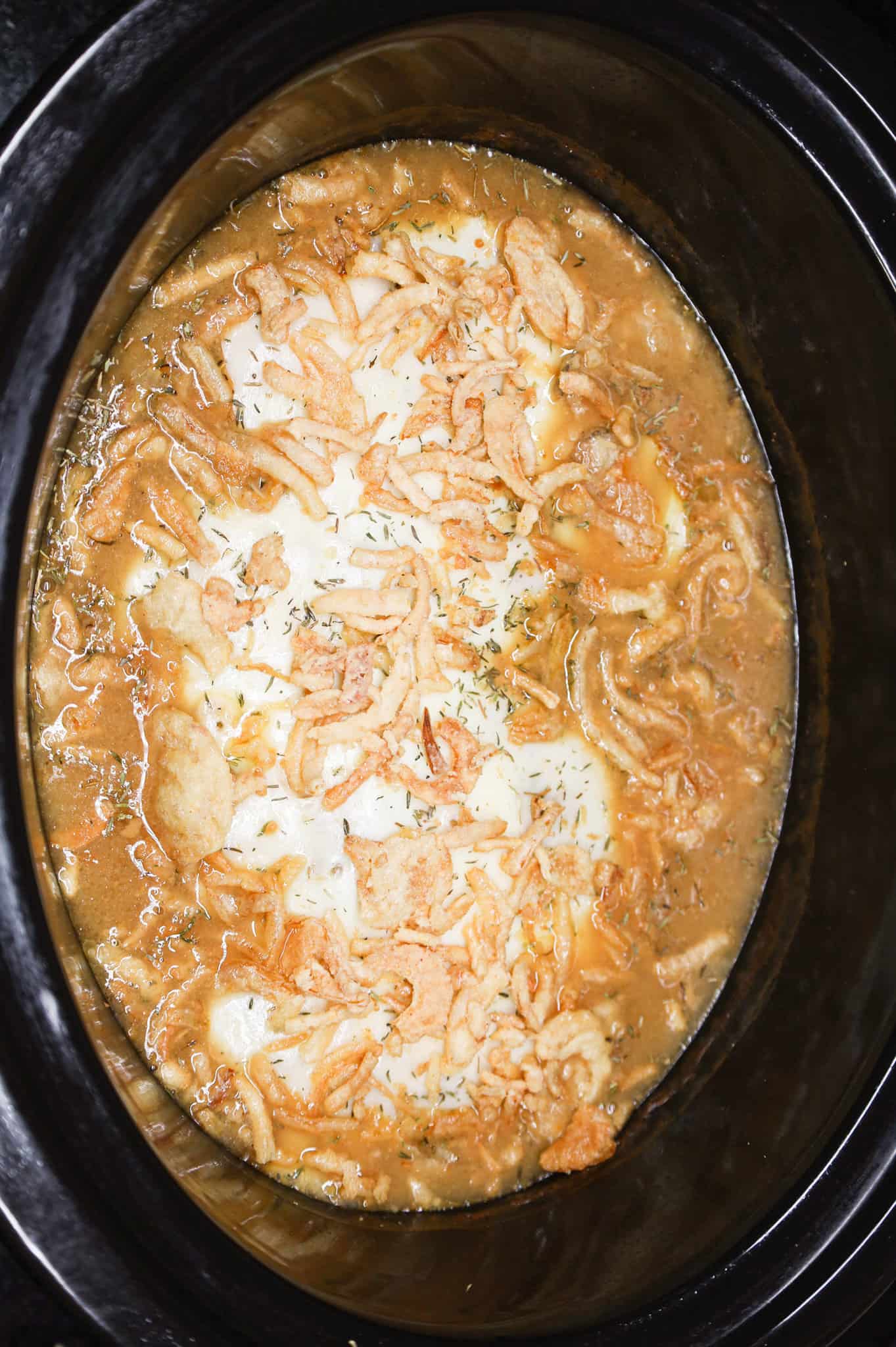 French's crispy fried onions sprinkled on top of French onion chicken in a crock pot