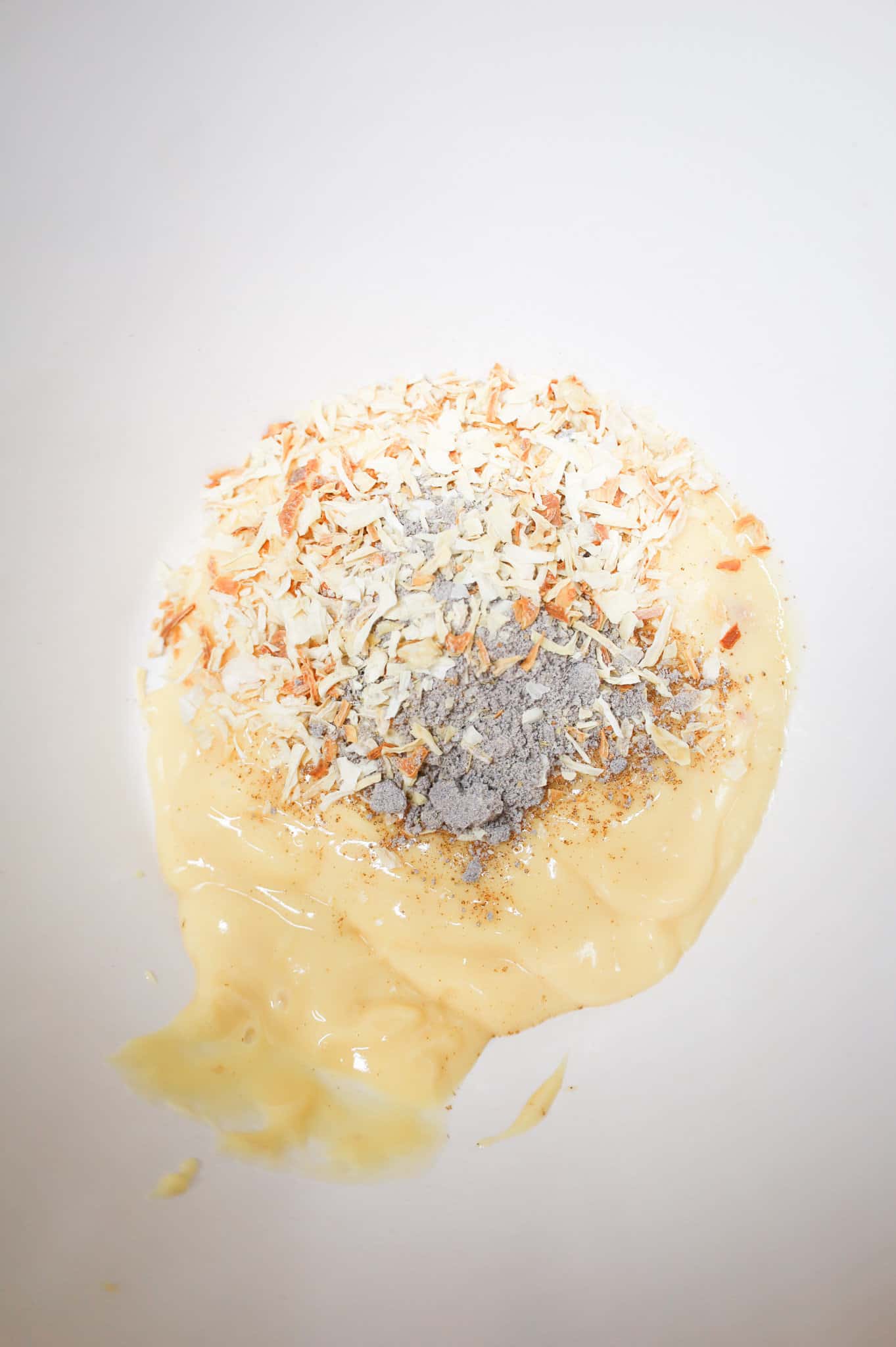 onion soup mix on top of cream of chicken soup in a mixing bowl