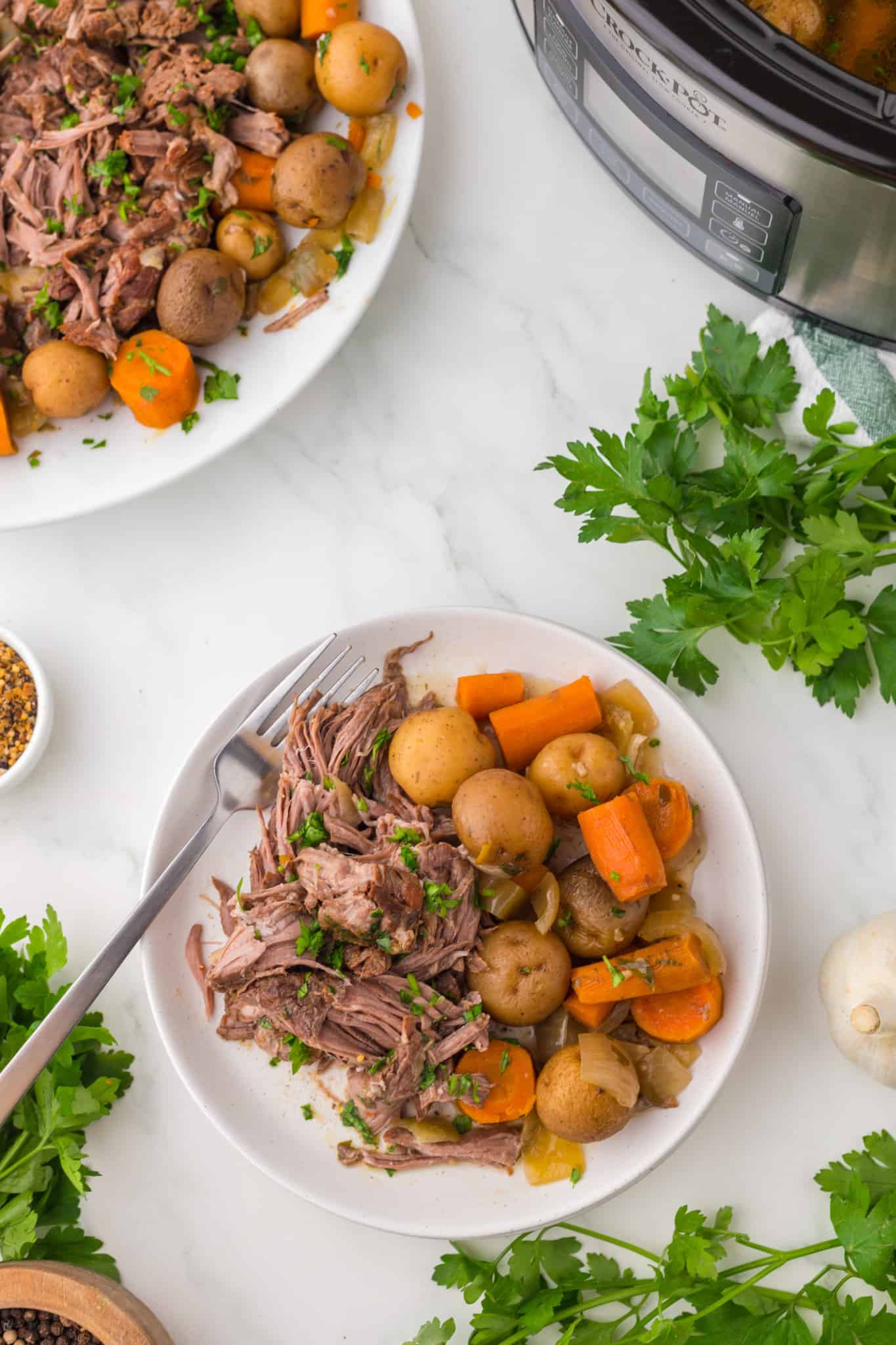 Crock Pot Pot Roast is a complete dinner recipe with a delicious tender beef roast, carrots and baby potatoes all cooked together in the slow cooker.