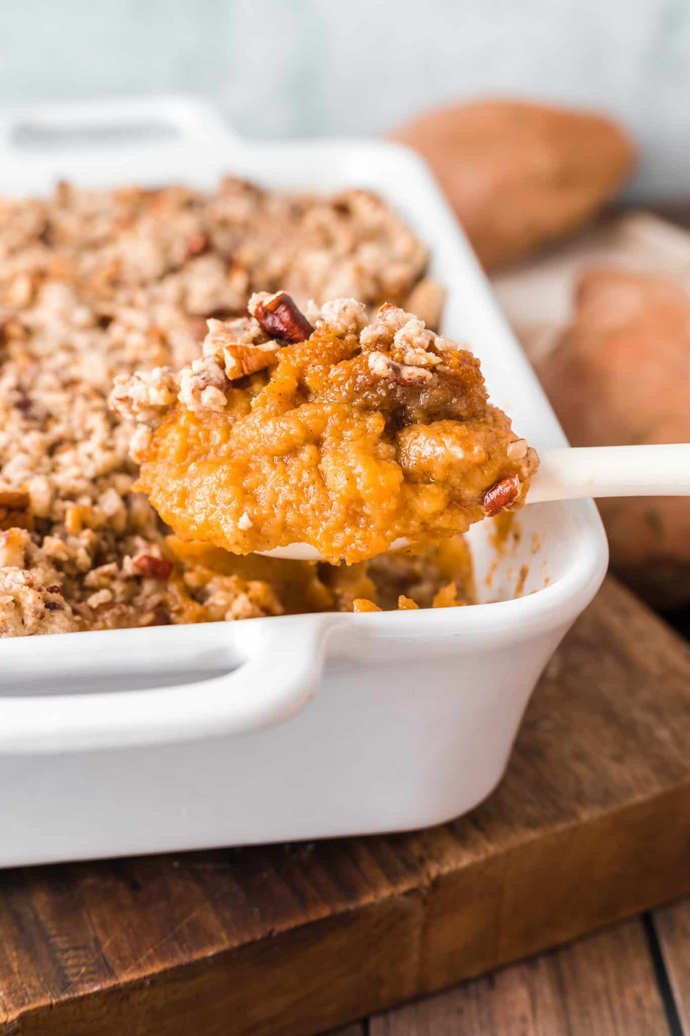 Easy Sweet Potato Casserole is a creamy sweet potato dish made with canned sweet potatoes and topped with a brown sugar pecan crumble.